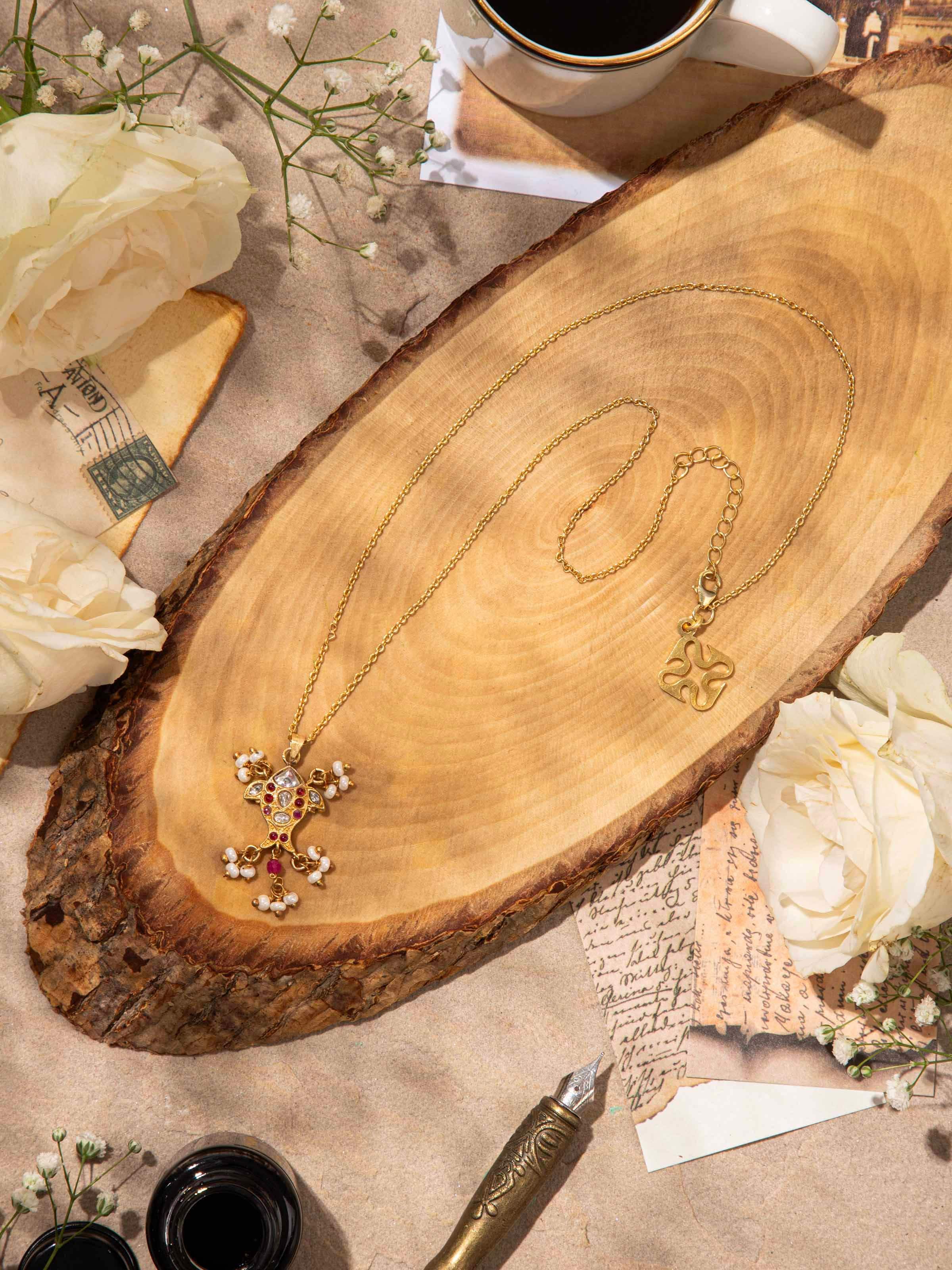 Lifestyle shot showcasing pendant and chain worn elegantly