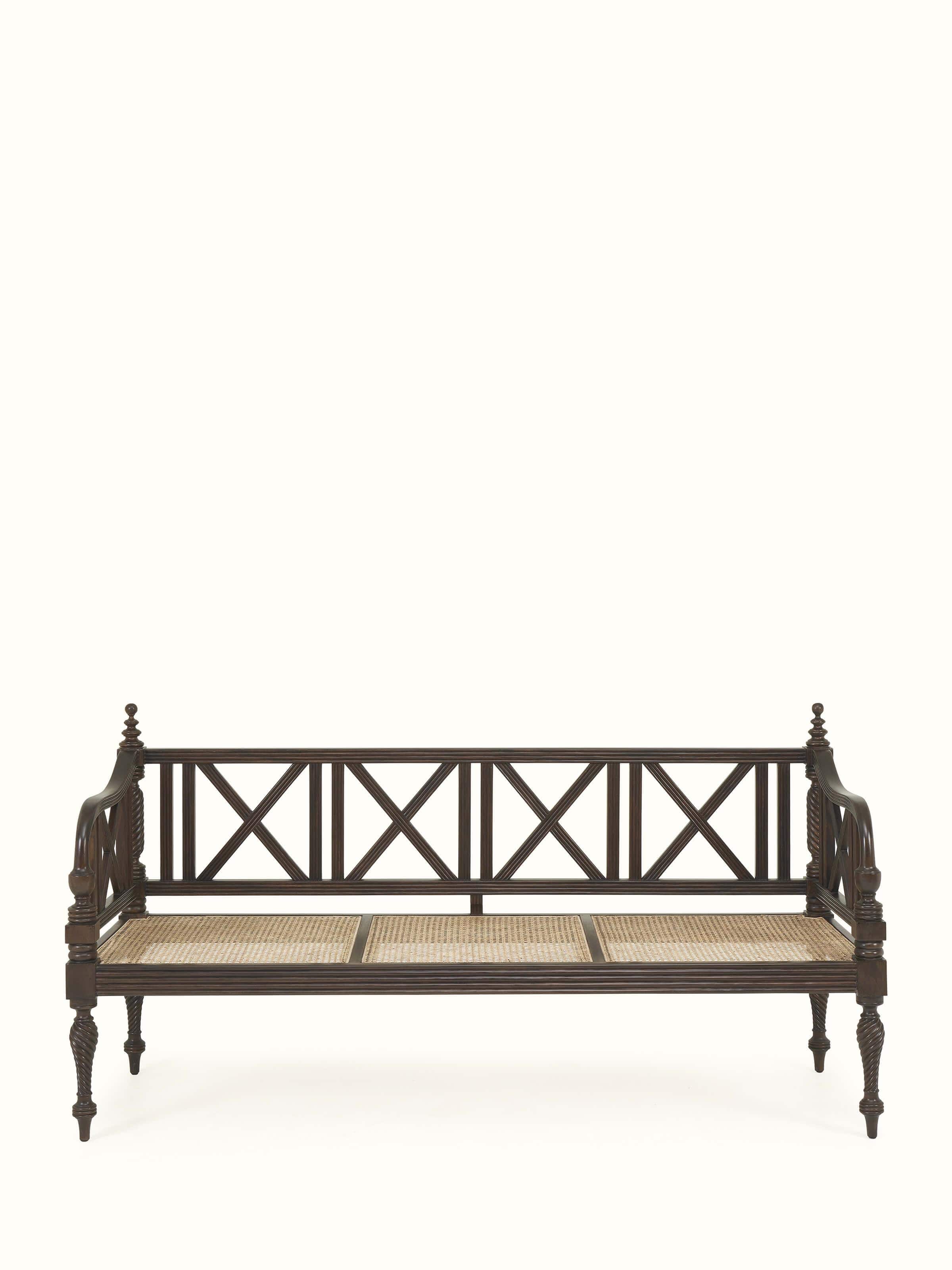 Front view of Walnut finish Mahogany wood and cane 3-seater sofa by Swadesh featuring luxurious cane panels and rich tone