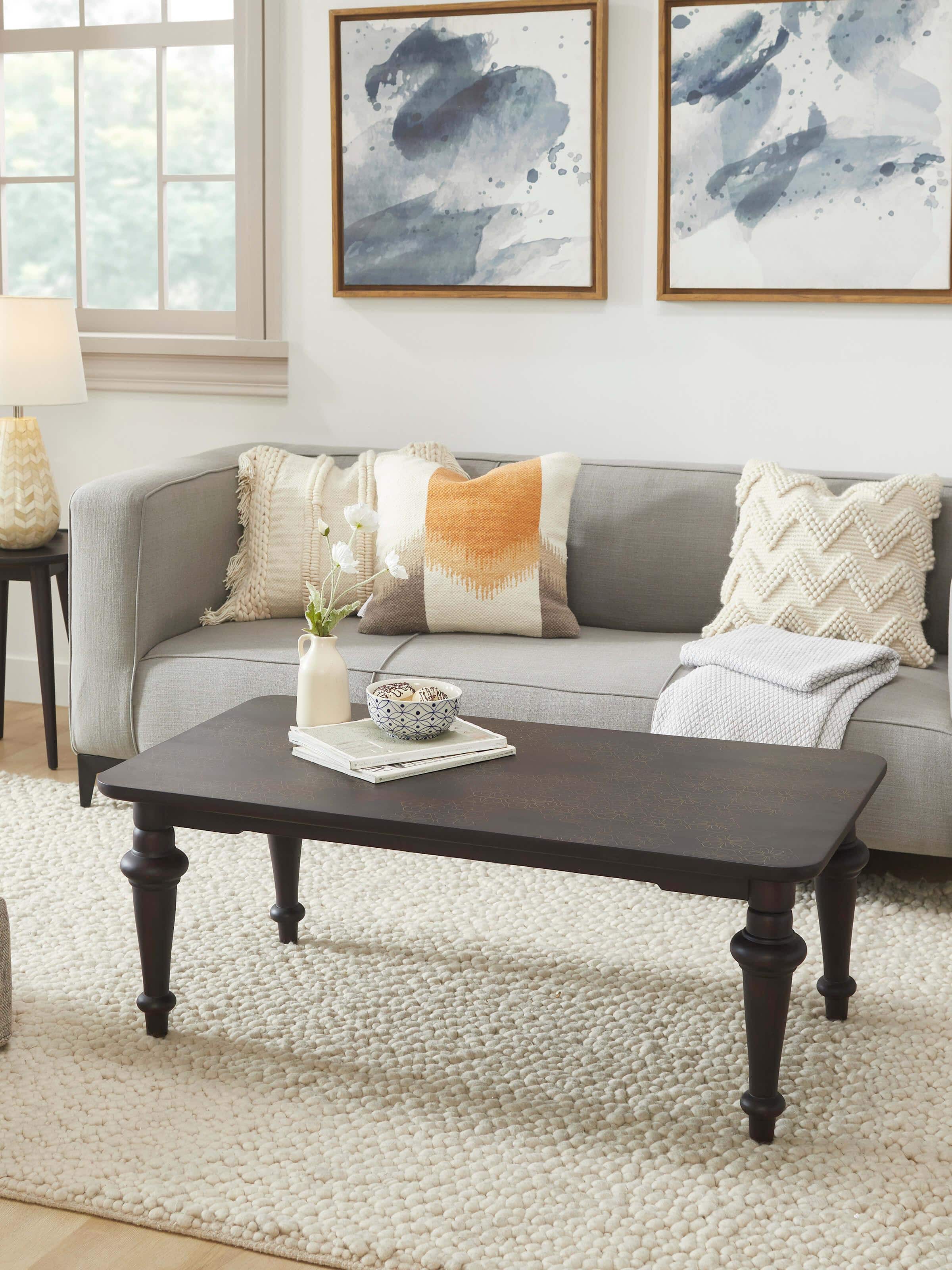 Close-up of the brass tarkashi inlay on the Sheesham wood coffee table, showcasing the craftsmanship and pattern