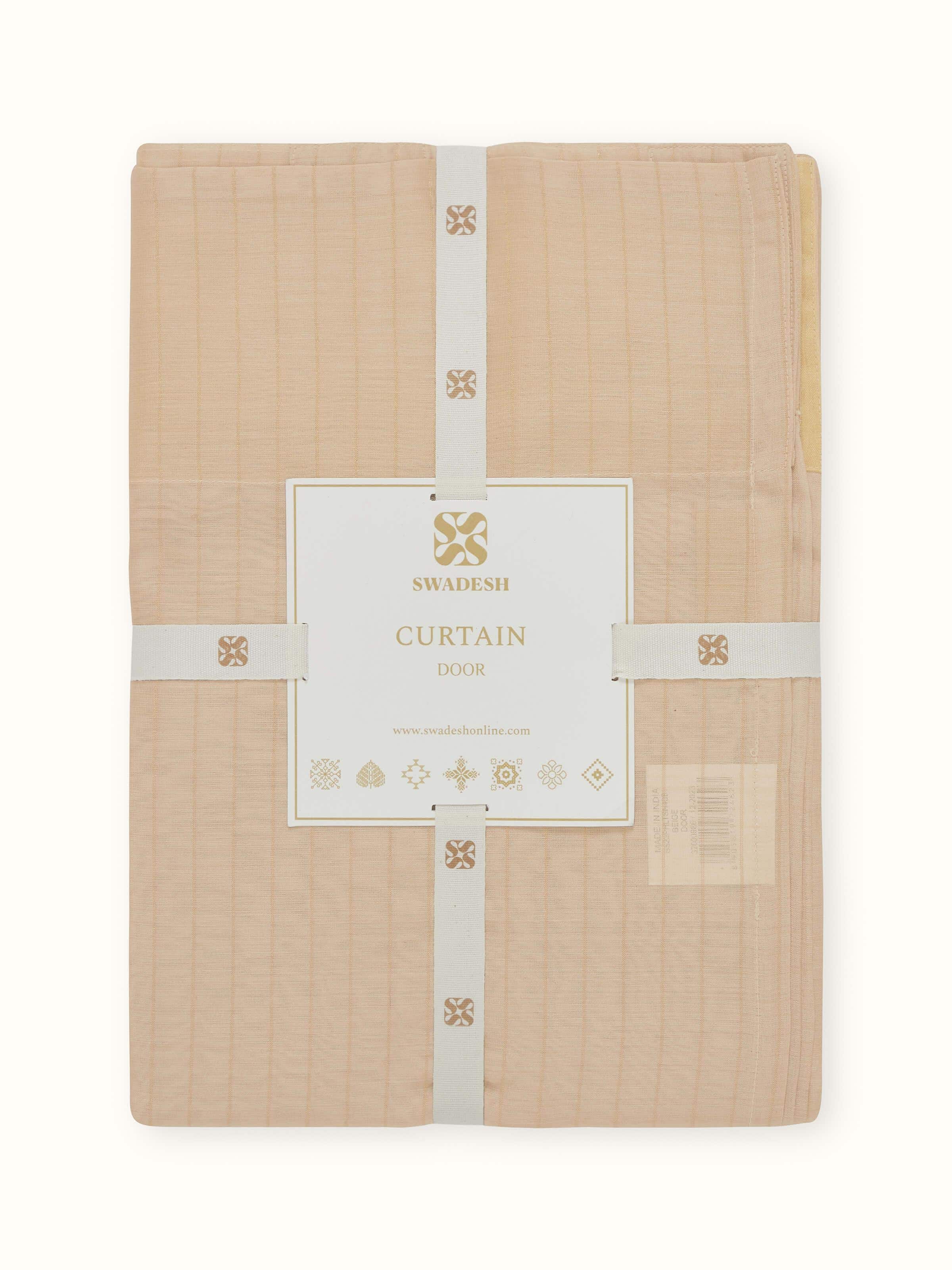 Close-up of sheer fabric texture and metallic stripes on beige Maheshwari silk cotton curtain.