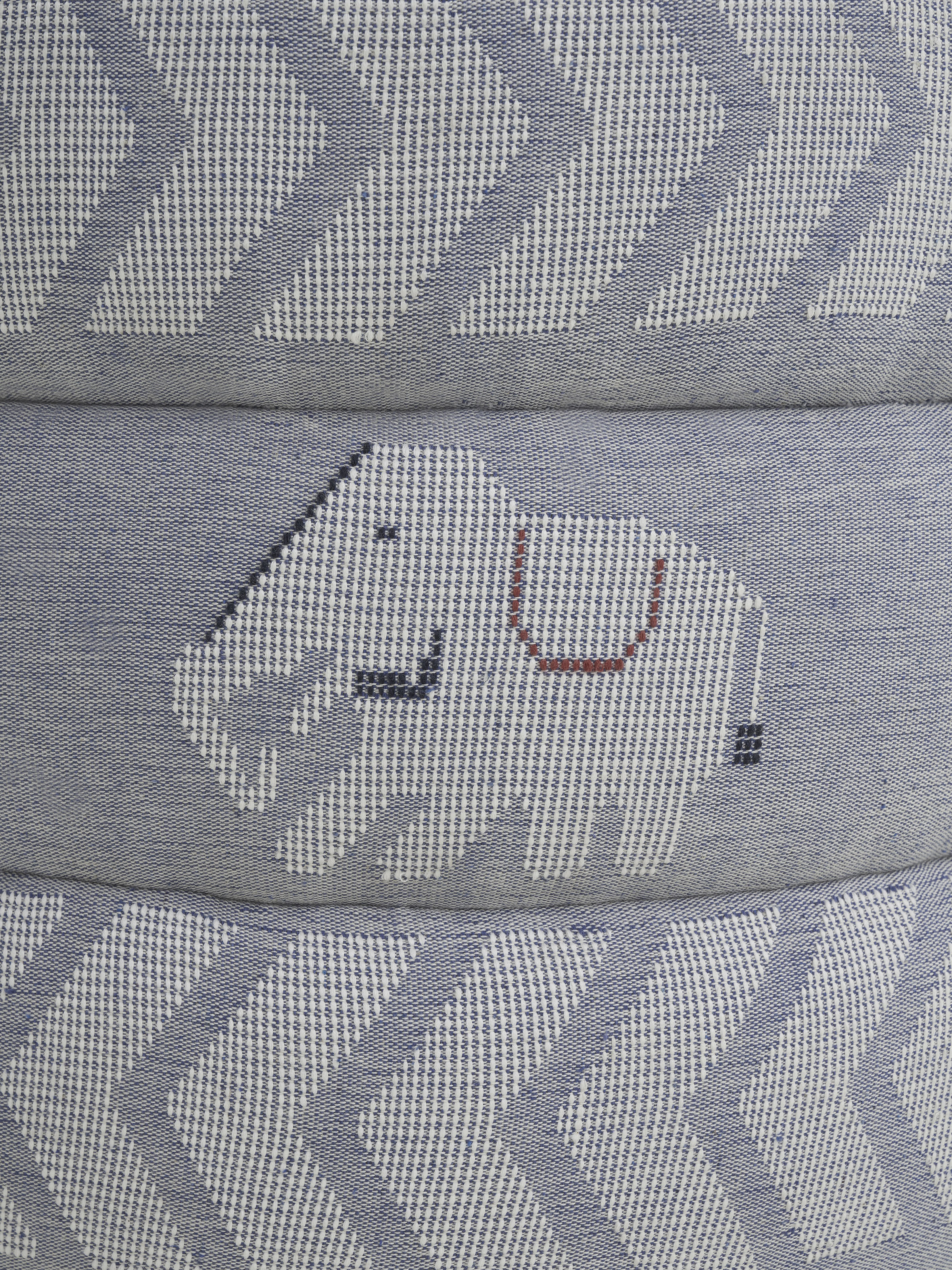 Detailed view of the pouffe’s fabric pattern and the quality of the Sheesham wood, emphasizing the fine finish and design