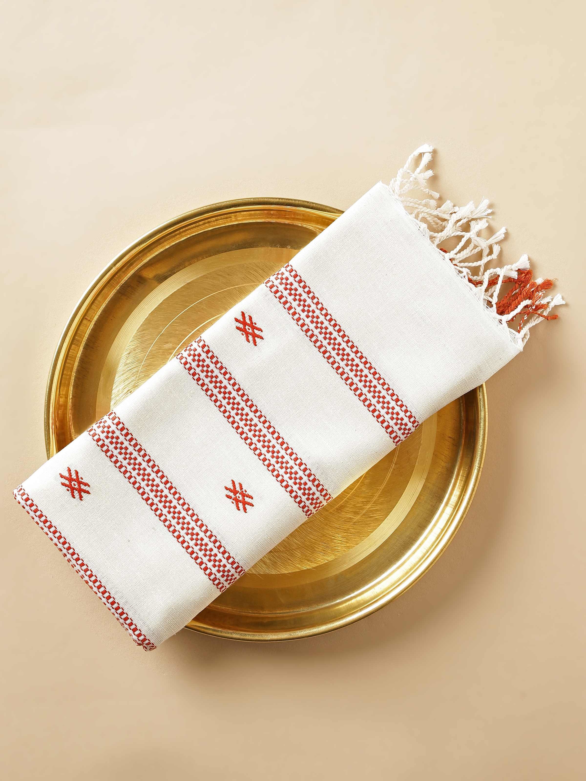 Close-up view of maroon cotton silk stole showcasing hemline and surface texture