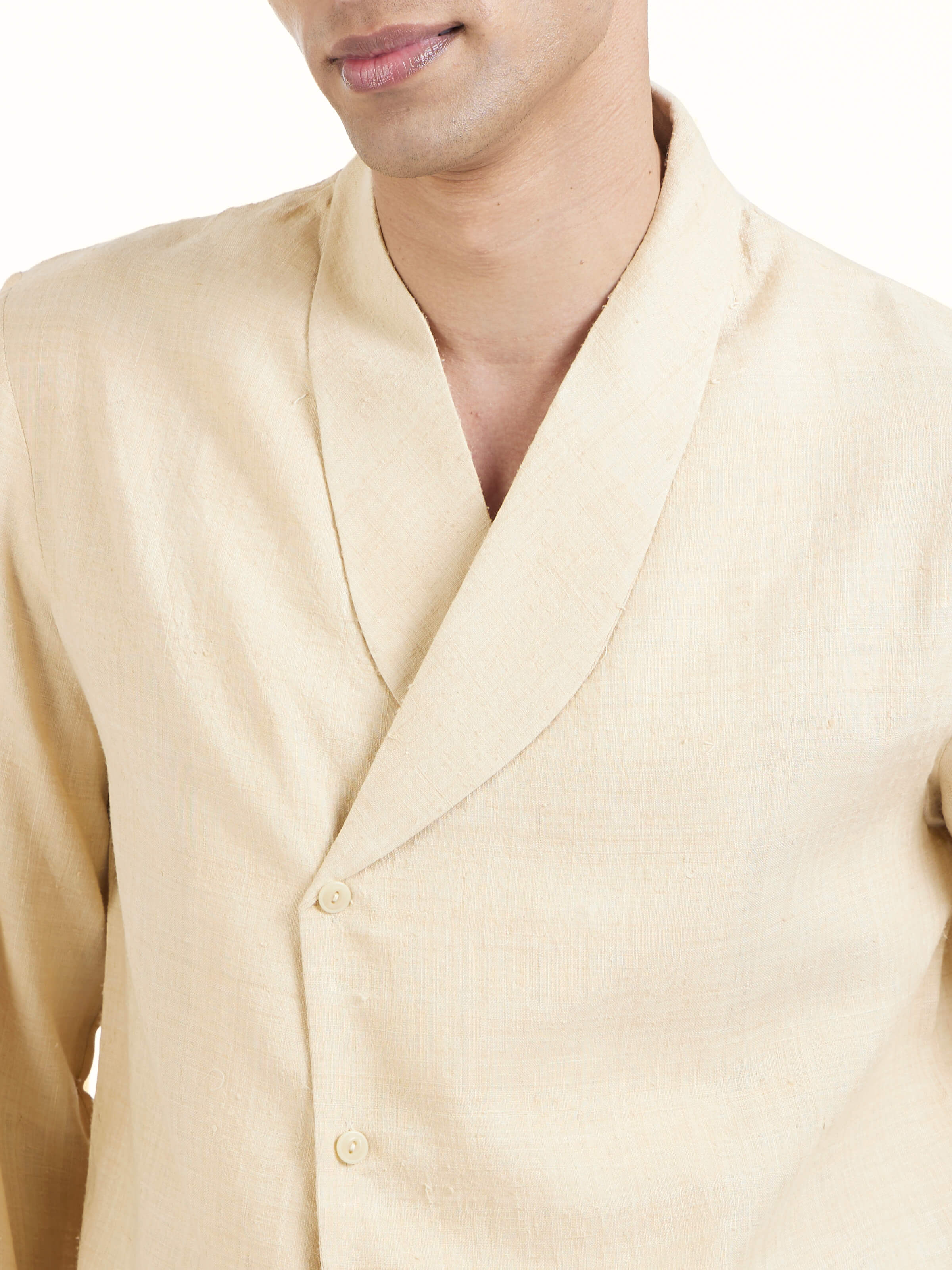 Detail view of beige silk handloom jacket showcasing fabric texture