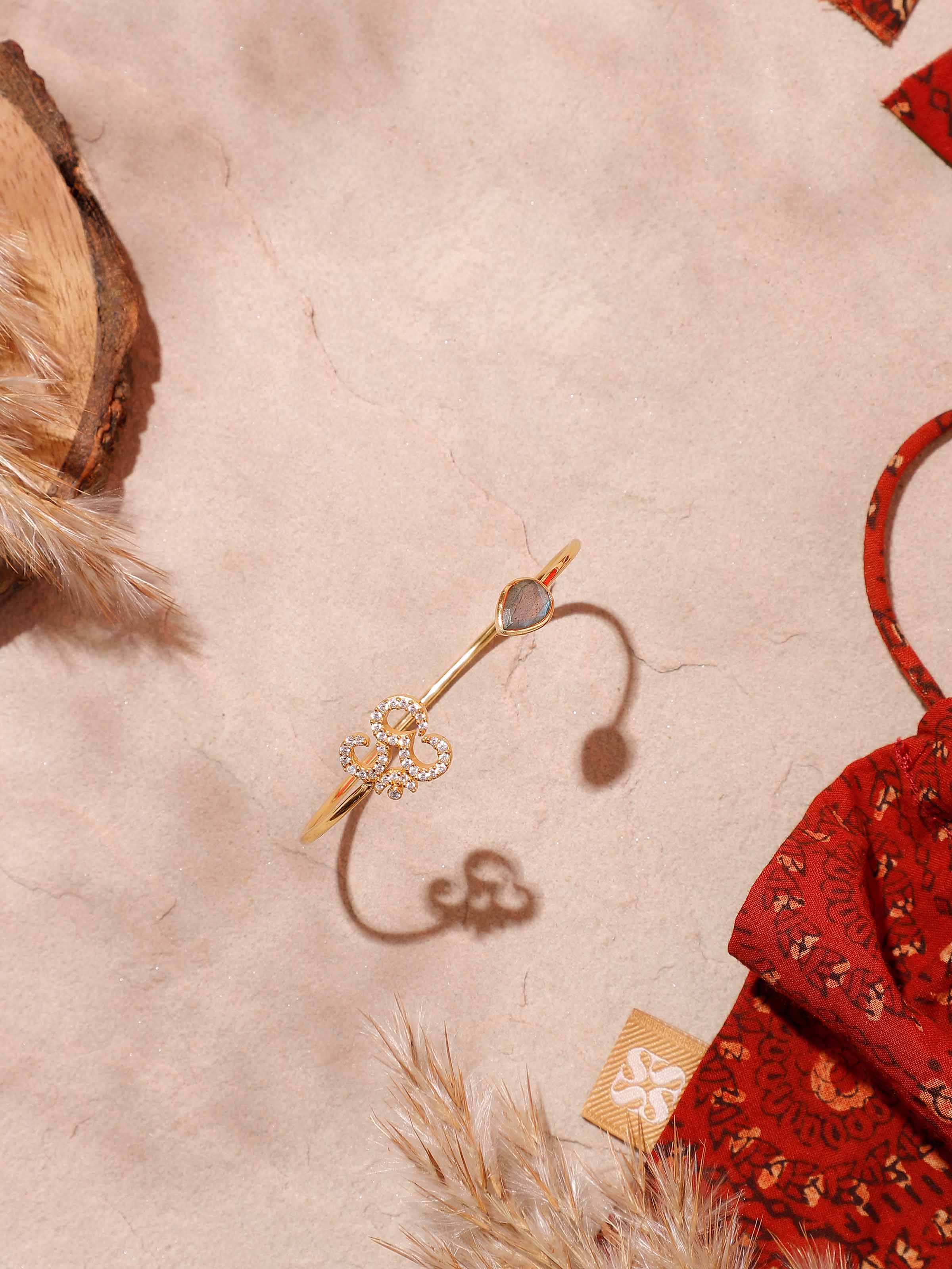 Side view of Labradorite & Om Bracelet, showcasing the shimmering stone and spiritual Om symbol