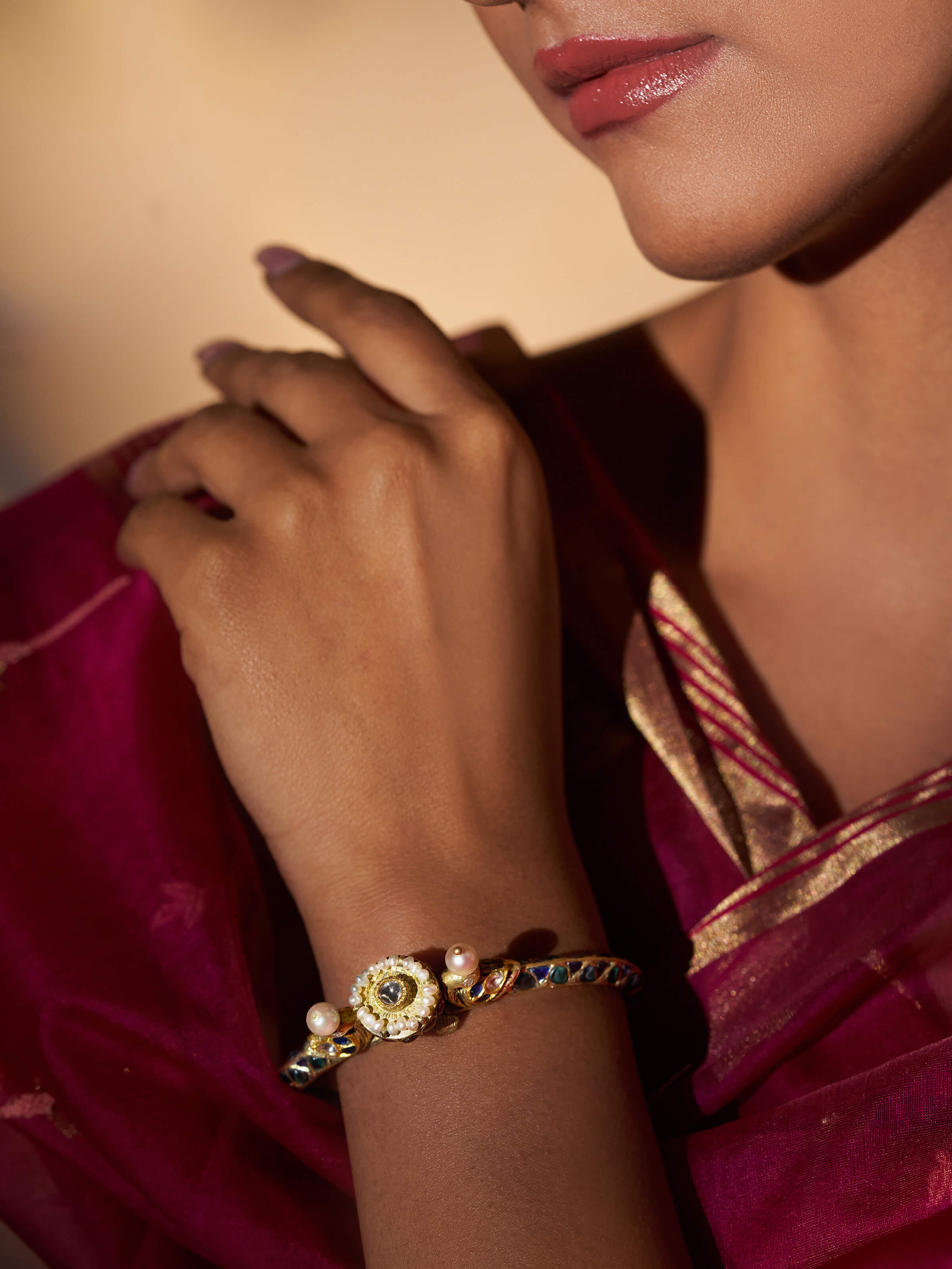 Side view of Partash 18 karat gold bangle showcasing its intricate detailing and luxurious goldwork