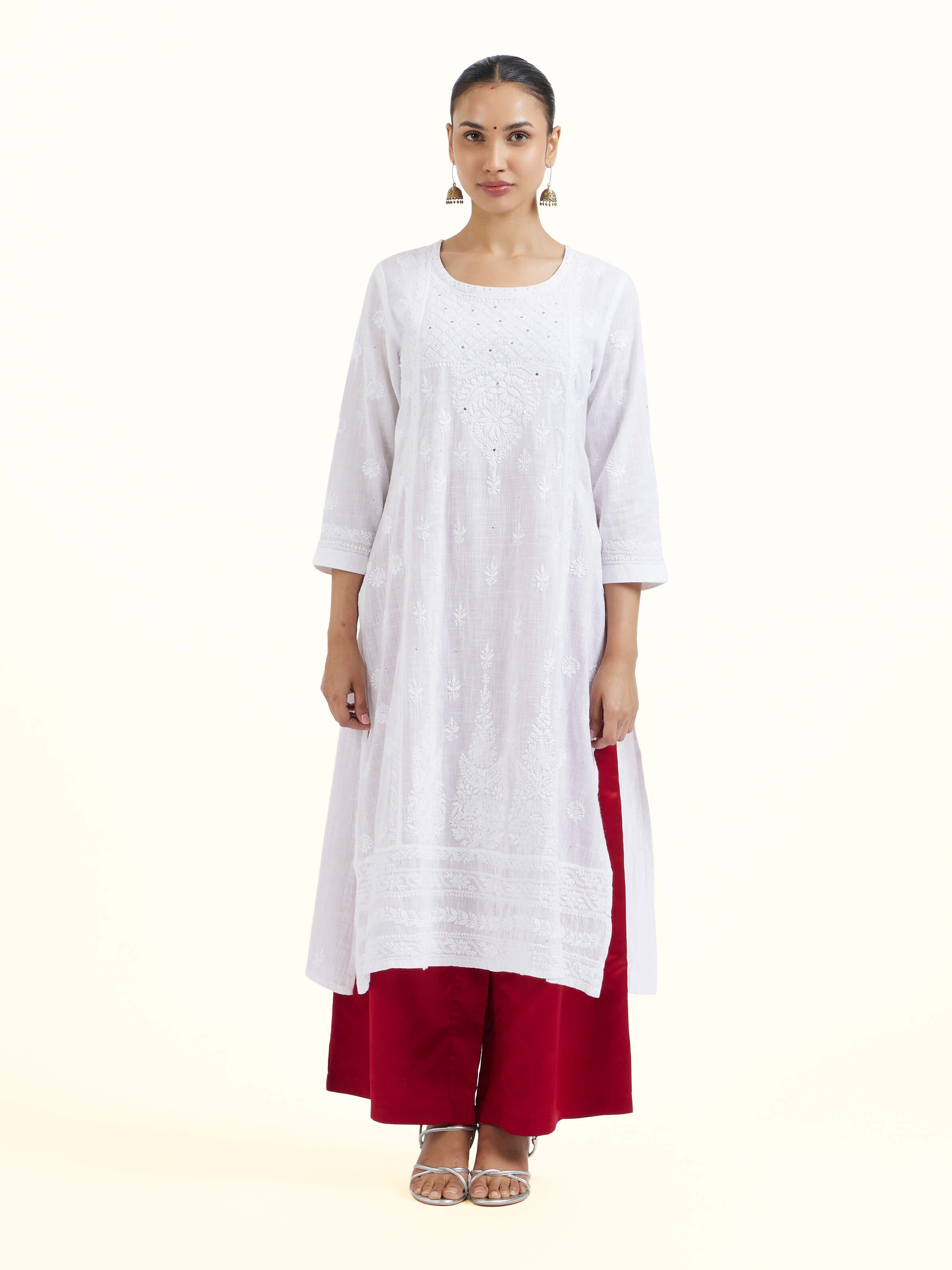 Front view of red silk Banarasi palazzos showcasing brocade pattern