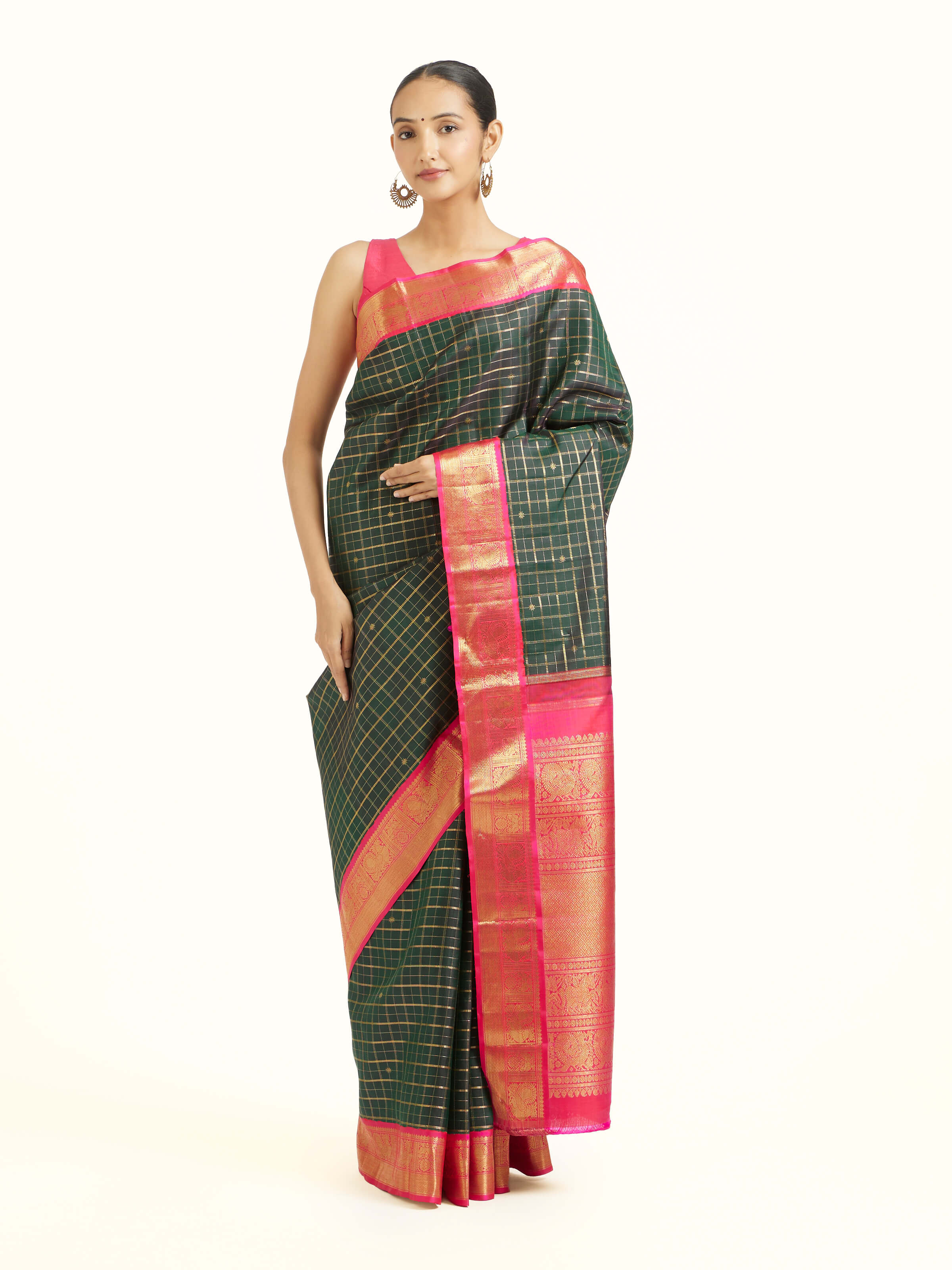 Front view of green silk Kancheepuram saree with rich zari woven motifs