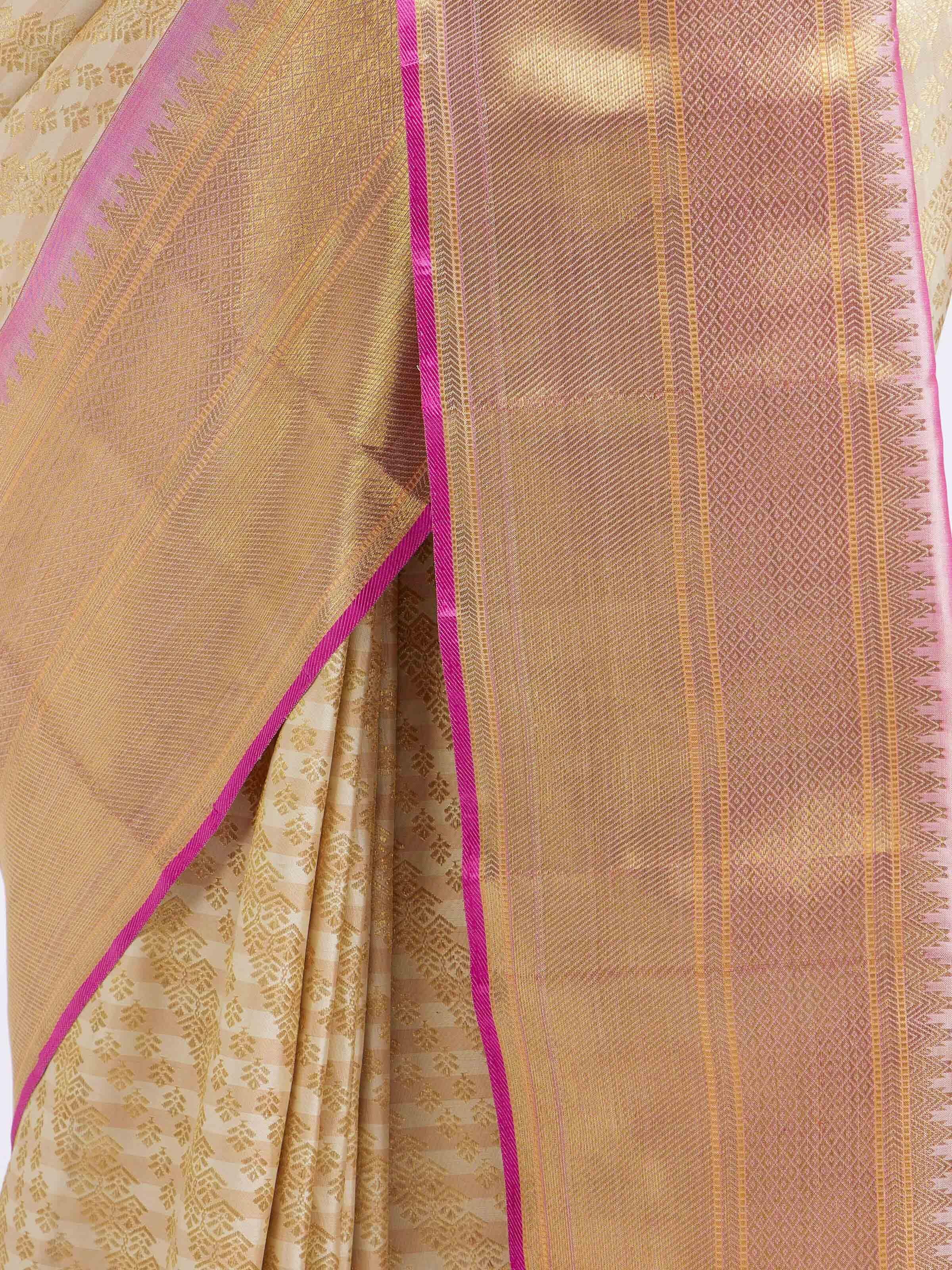 Detail view of off-white silk Kancheepuram saree showing silk texture and weaving details