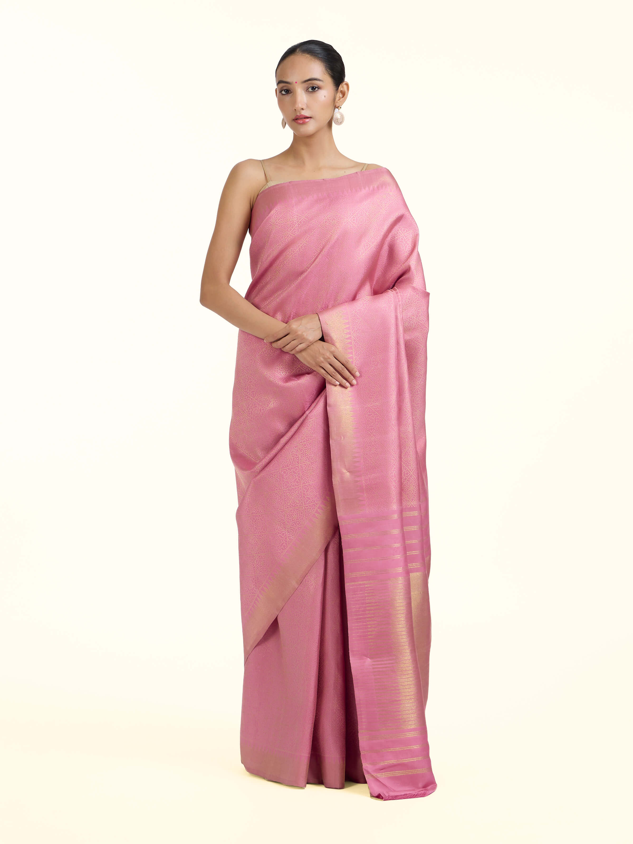 Front view of light pink silk Kancheepuram saree with rich zari motifs