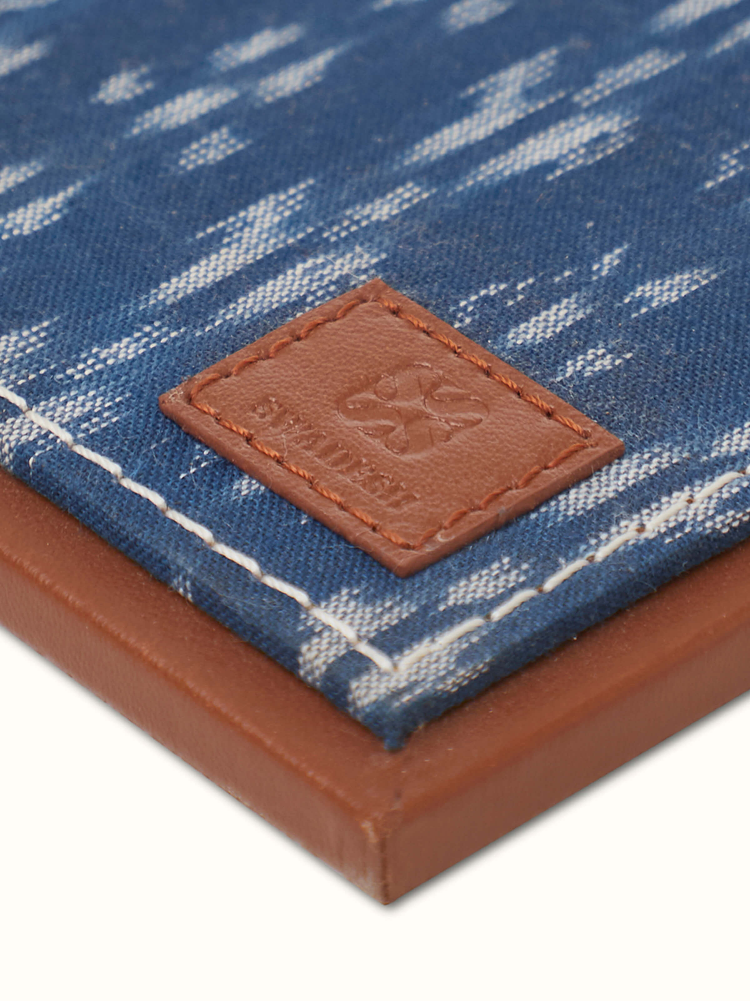 Artistic view of Swadesh Leather Desk Blotter in blue emphasizing its smooth surface and premium quality finish.