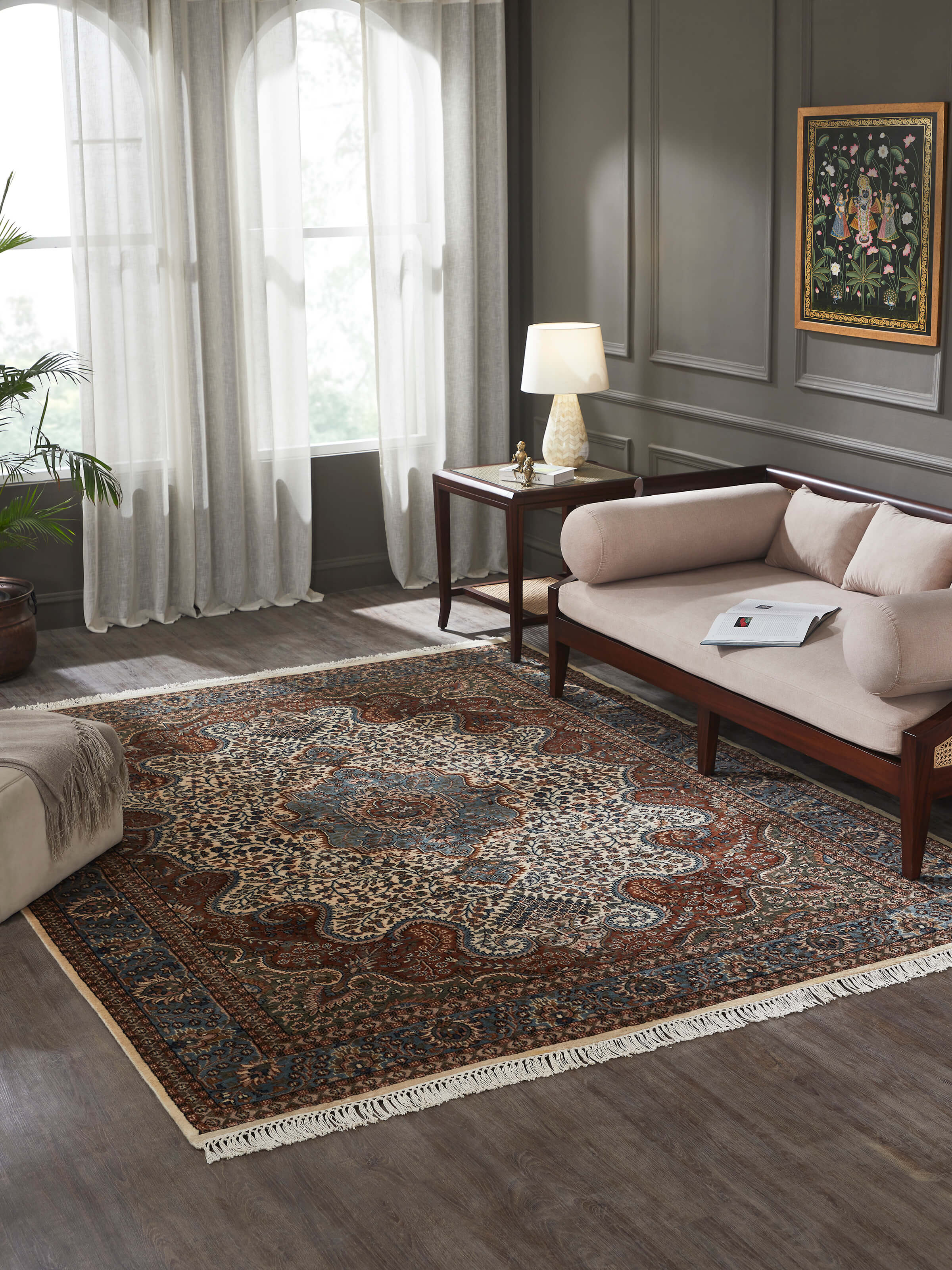 Styled in an elegant room, the hand-knotted rug anchors the space with its heritage-inspired design.