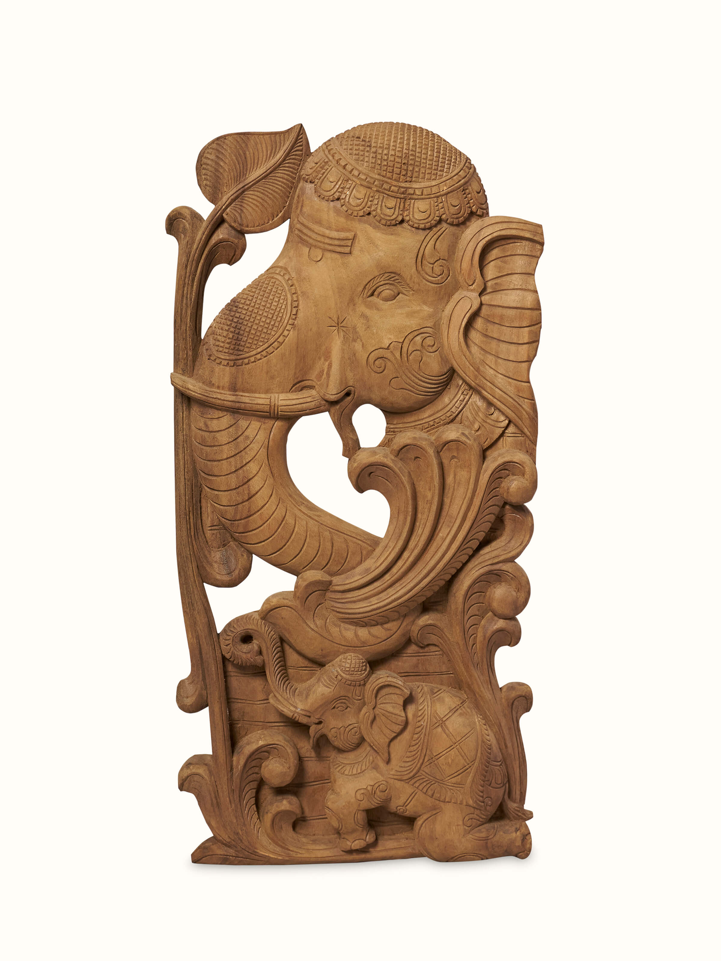 Close-up view of Tenali Carved Neem Wood Elephant Face Brackets Sculpture (2Pcs) by Swadesh showcasing fine carving and the artistic texture of neem wood.