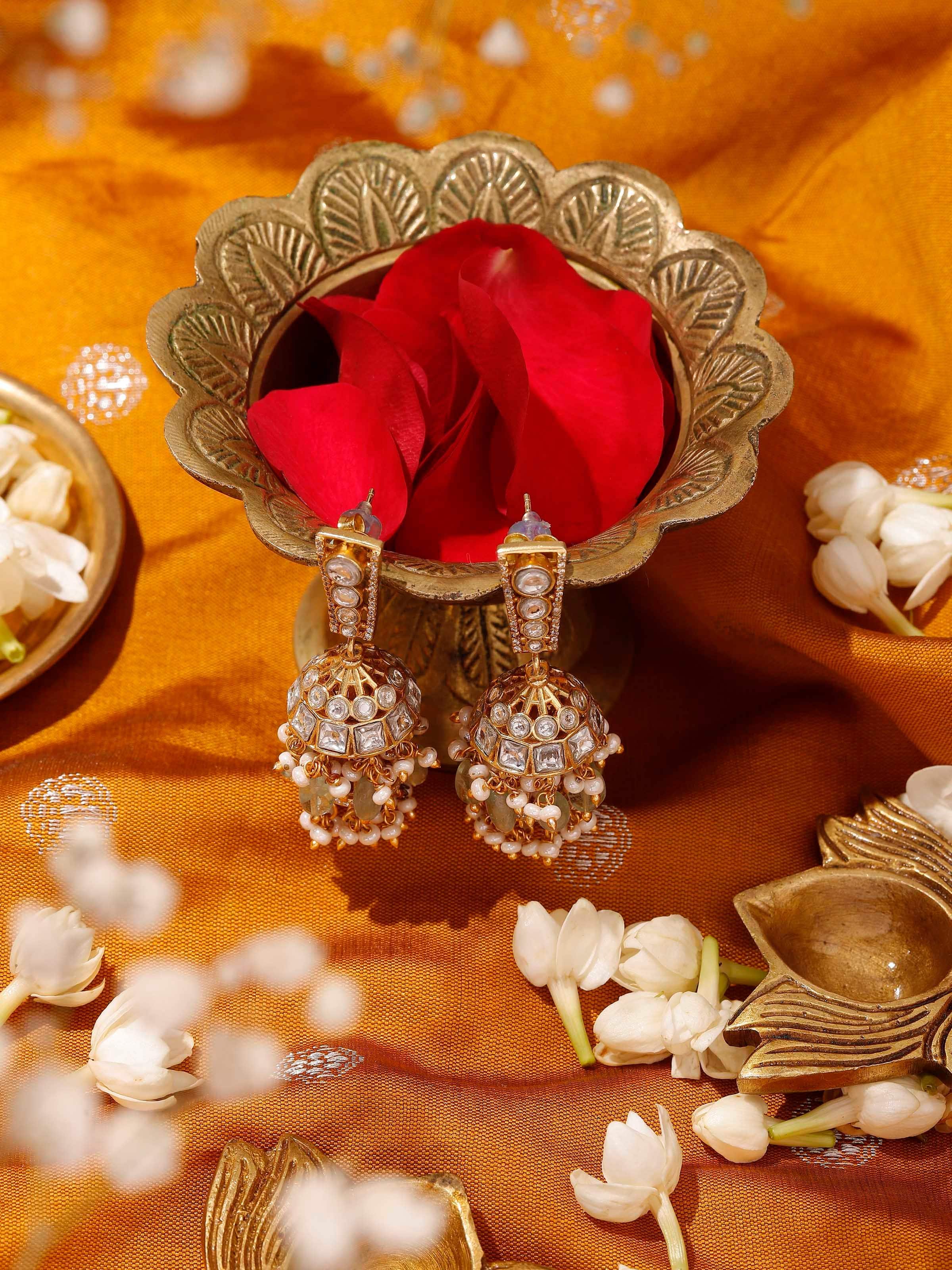 Lifestyle image of Silver Smithing jhumkas worn with saree, enhancing traditional appeal.