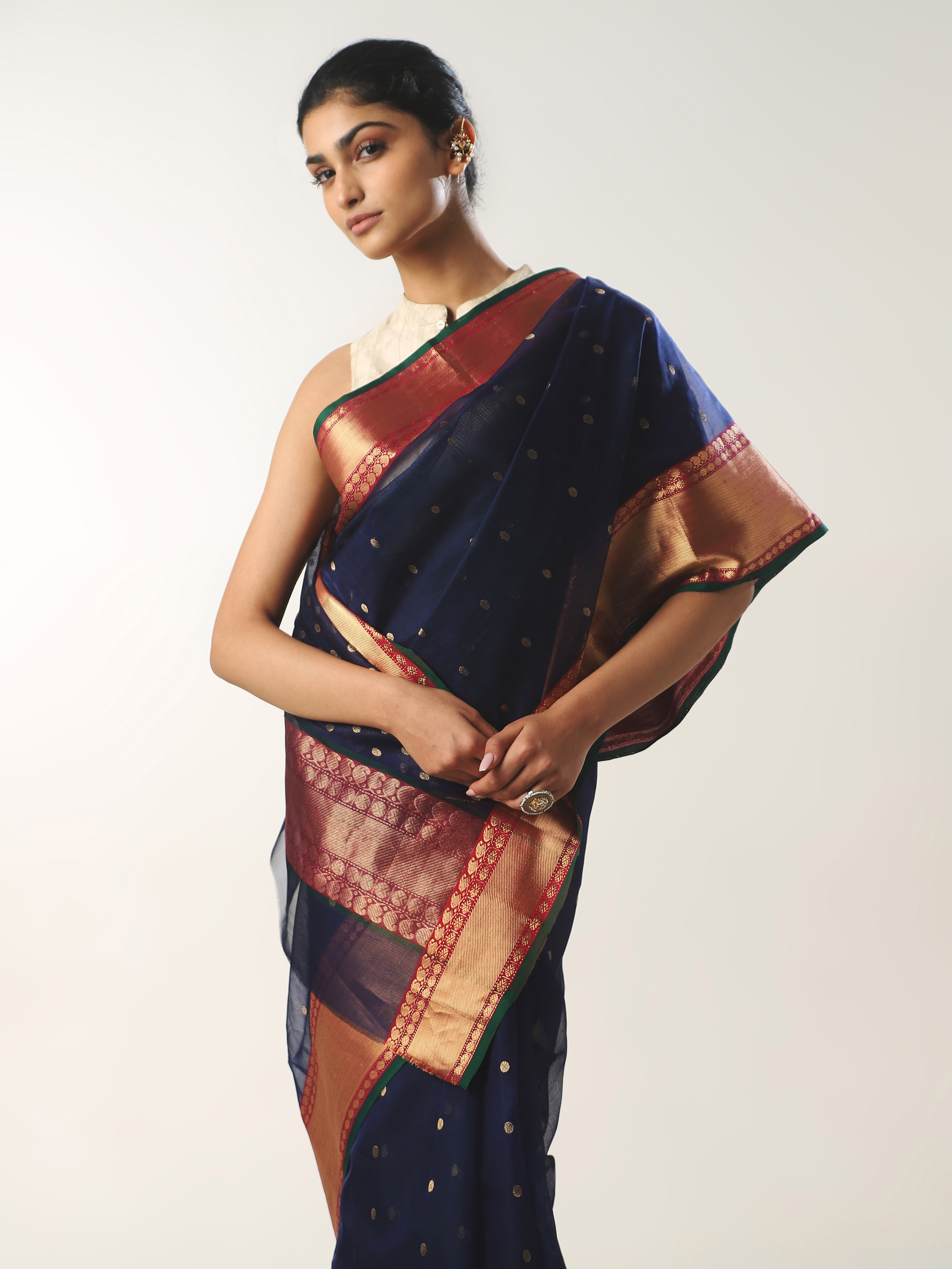 Angled view of blue cotton silk Chanderi saree emphasizing texture and intricate weave