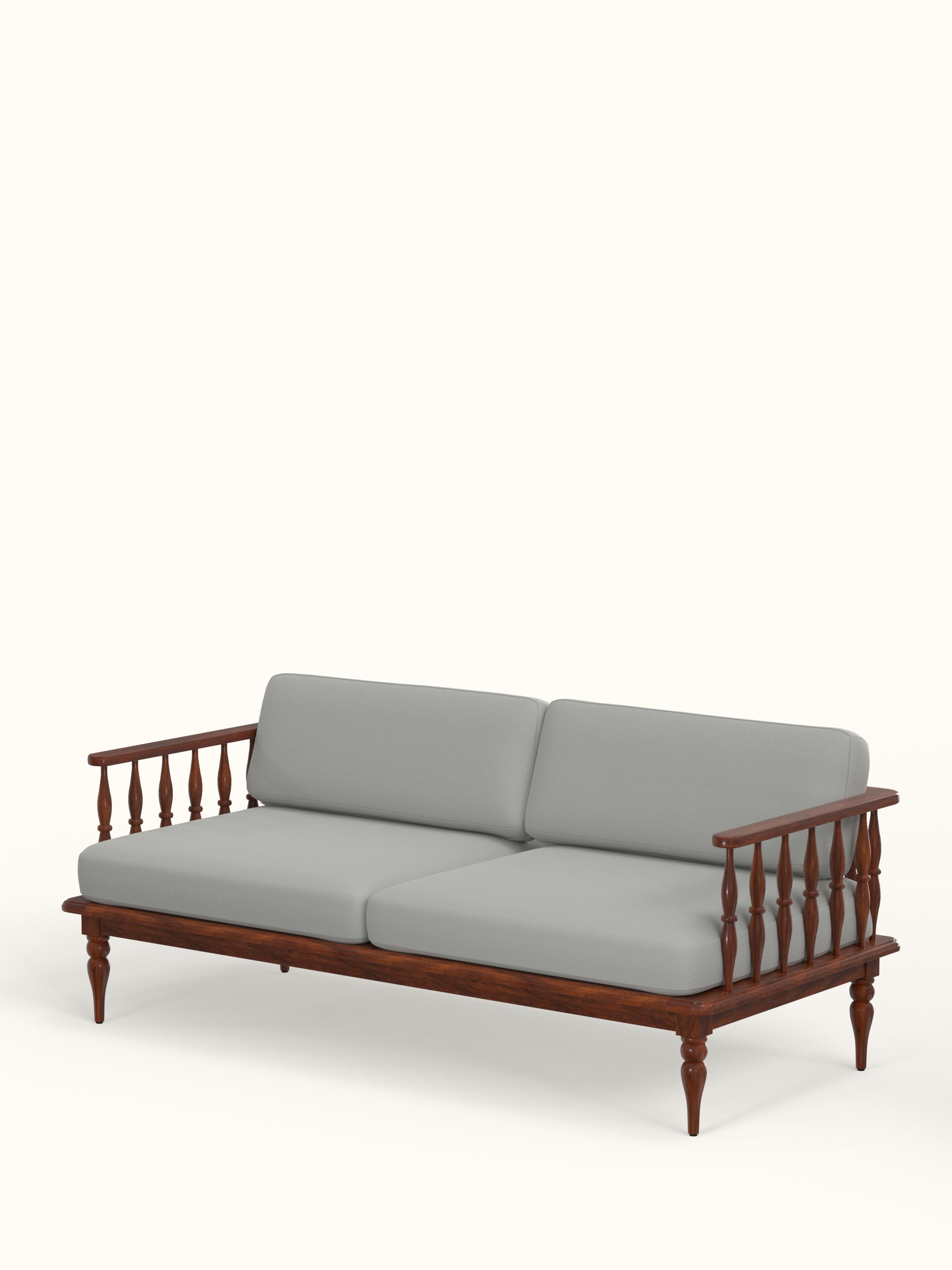 Side view of the blue plain fabric upholstered Sheesham wood 3-seater sofa, highlighting its armrest and wooden frame details