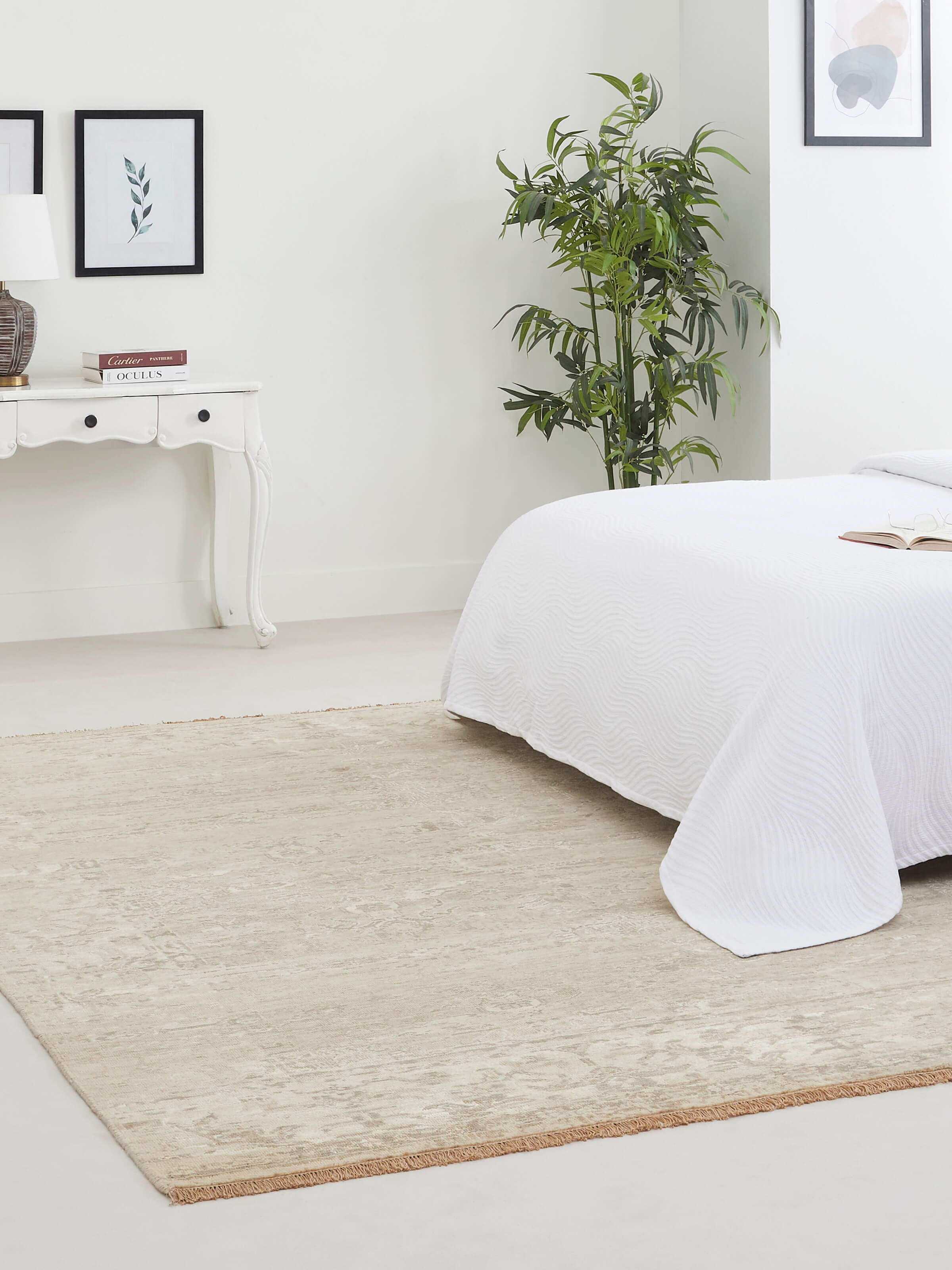 The rug’s soft sheen and blended tones bring a contemporary yet warm feel to the space.