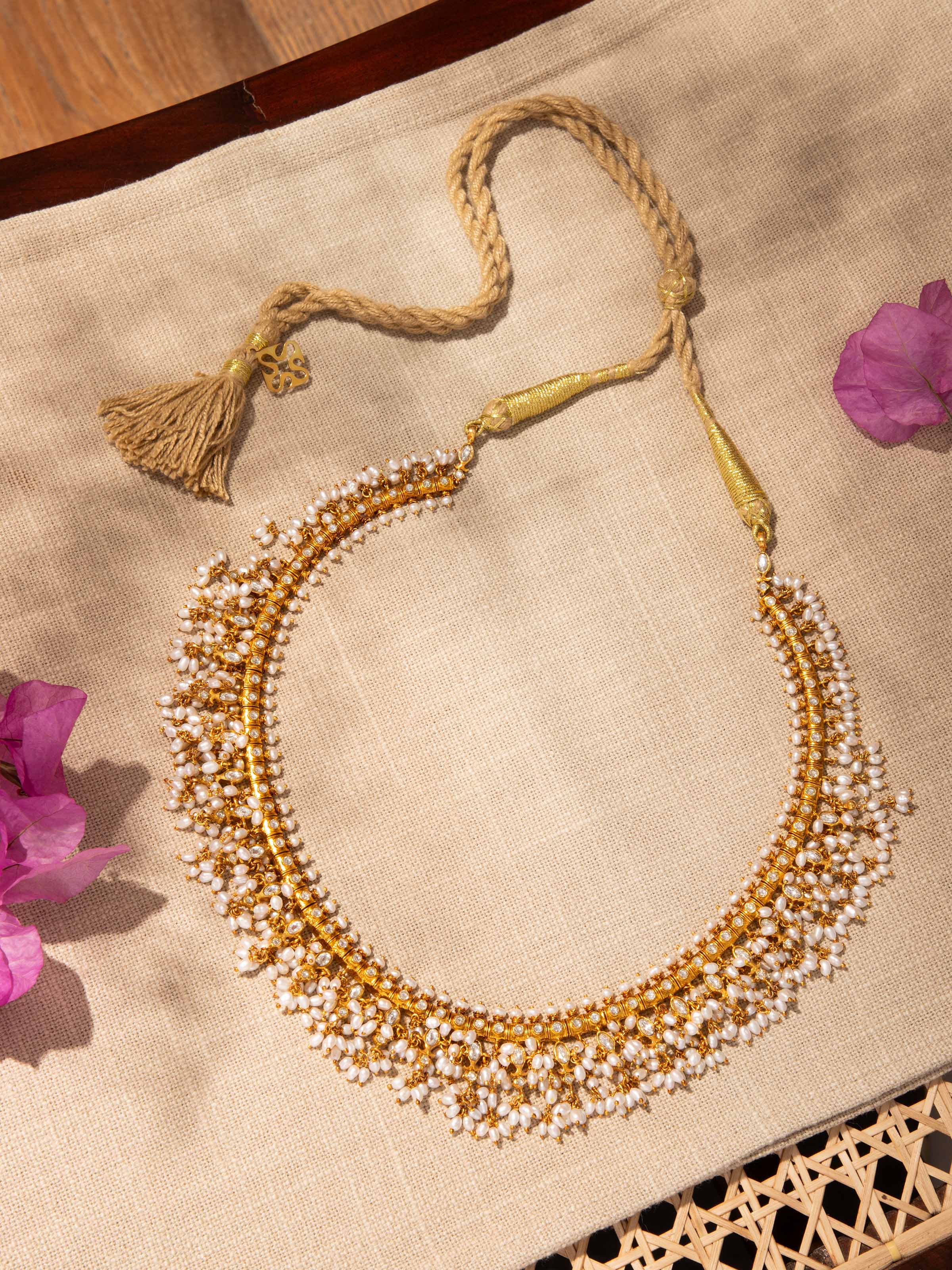 Lifestyle shot of Guttapusalu silver collar necklace styled with traditional attire.