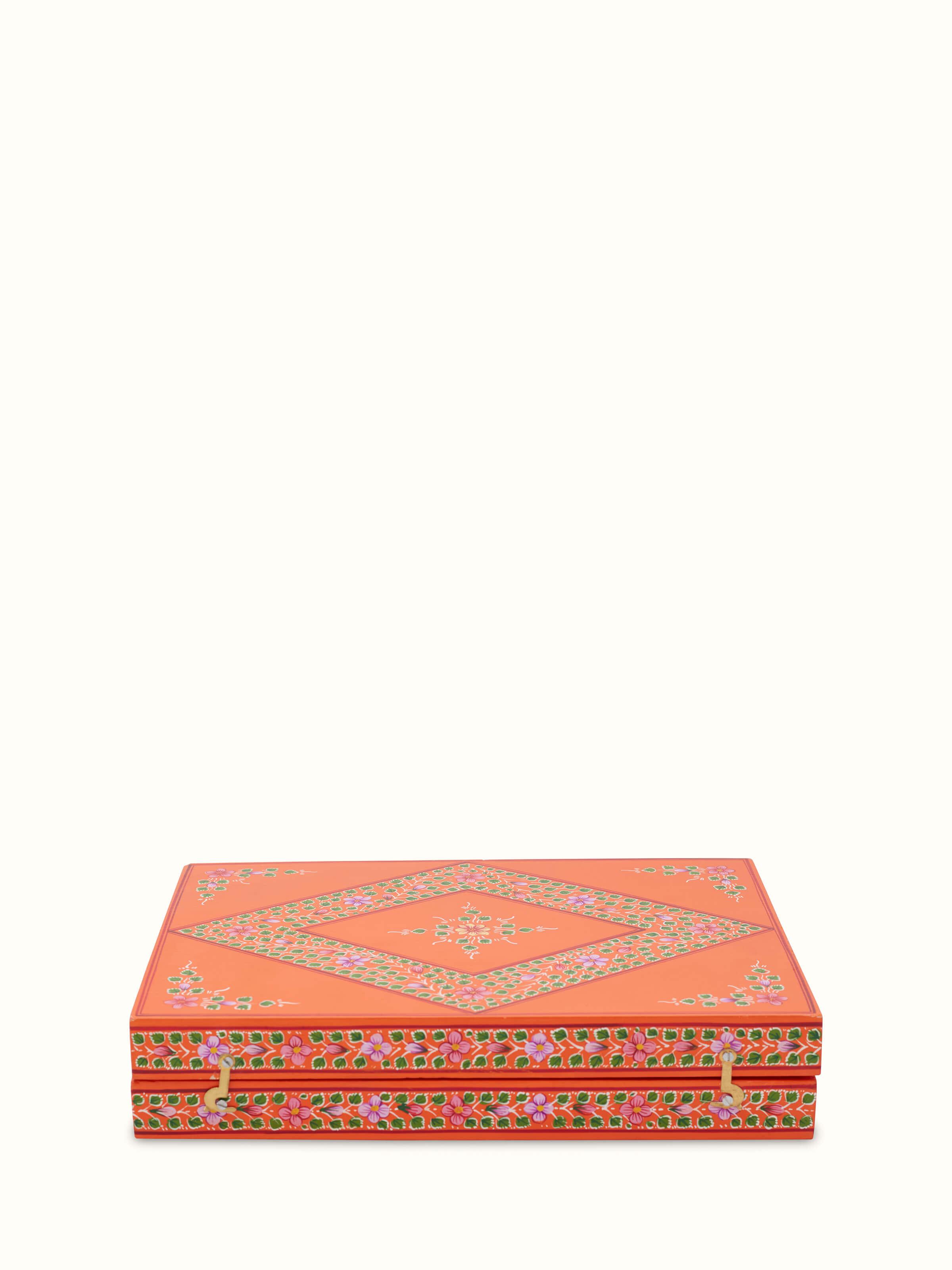 Front view of Ganjifa cedar wood backgammon in orange with detailed craftsmanship and vibrant colors