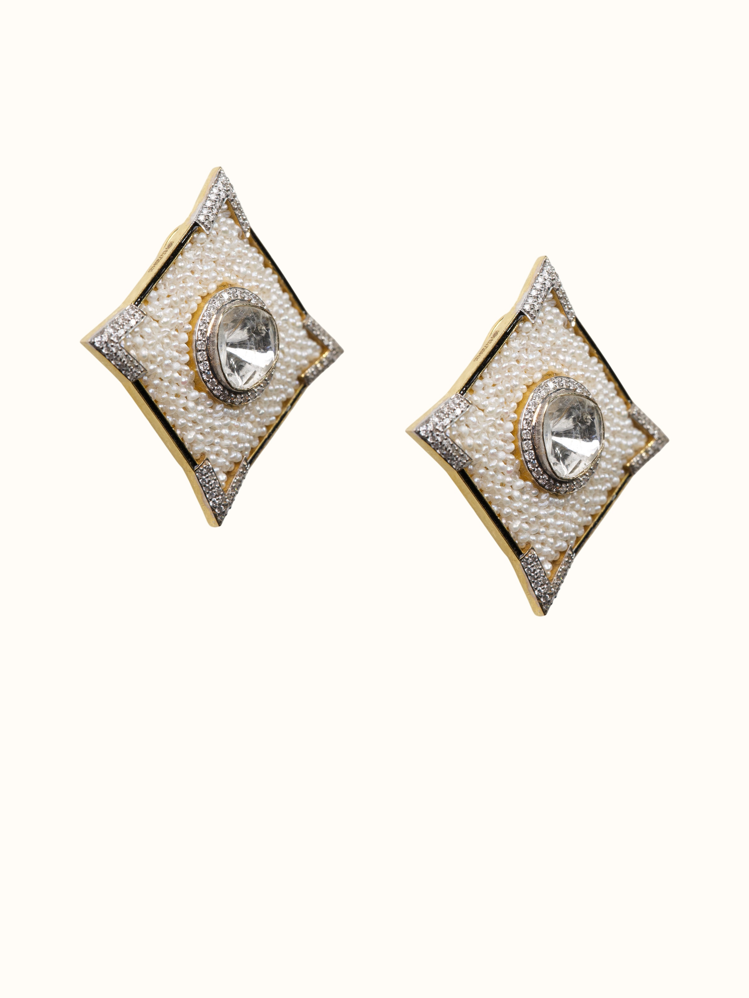 angled view of dank polki 14 karat studs