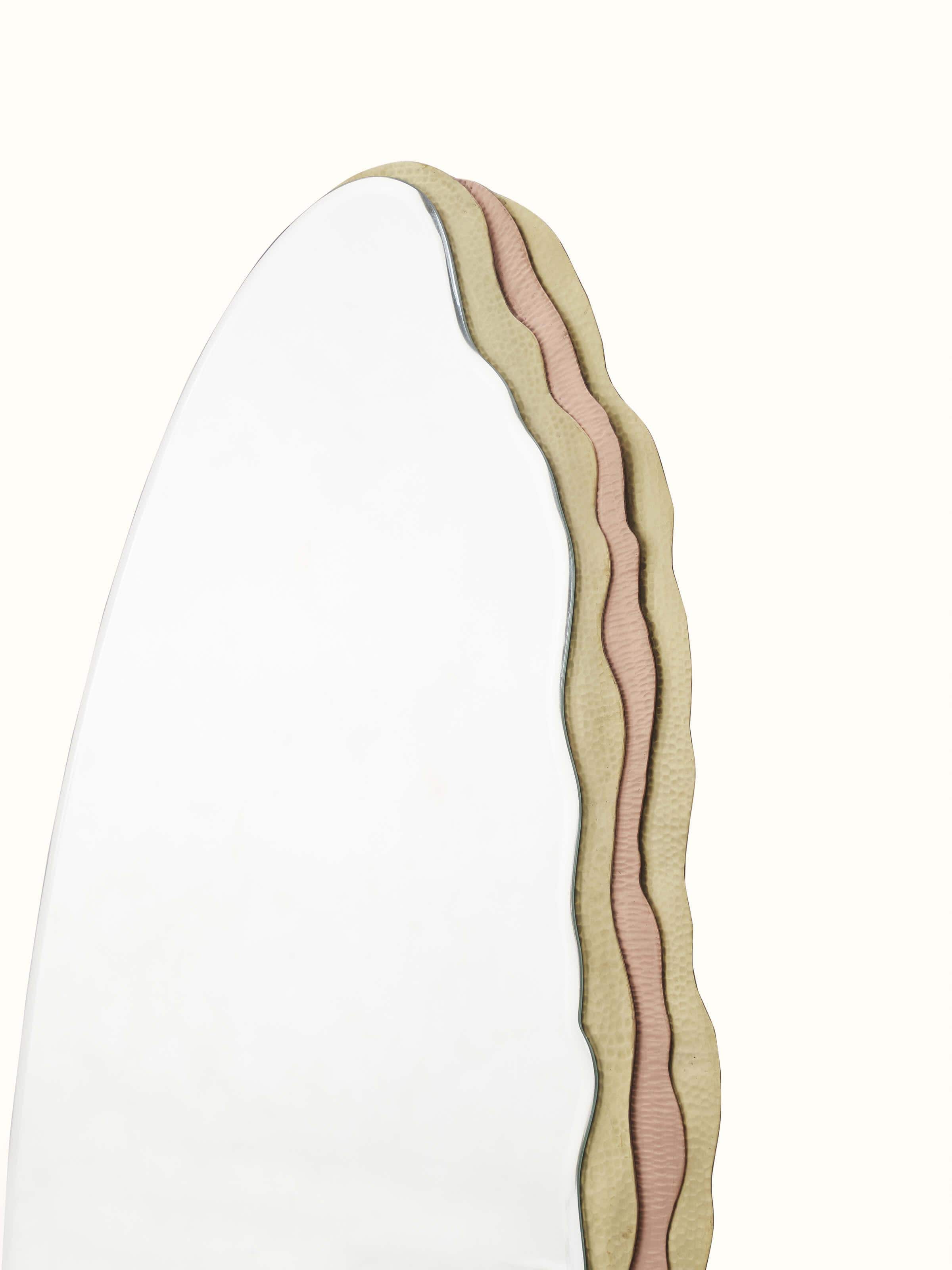 Angled view of the Thathera mirror displaying its full-length design and reflective quality