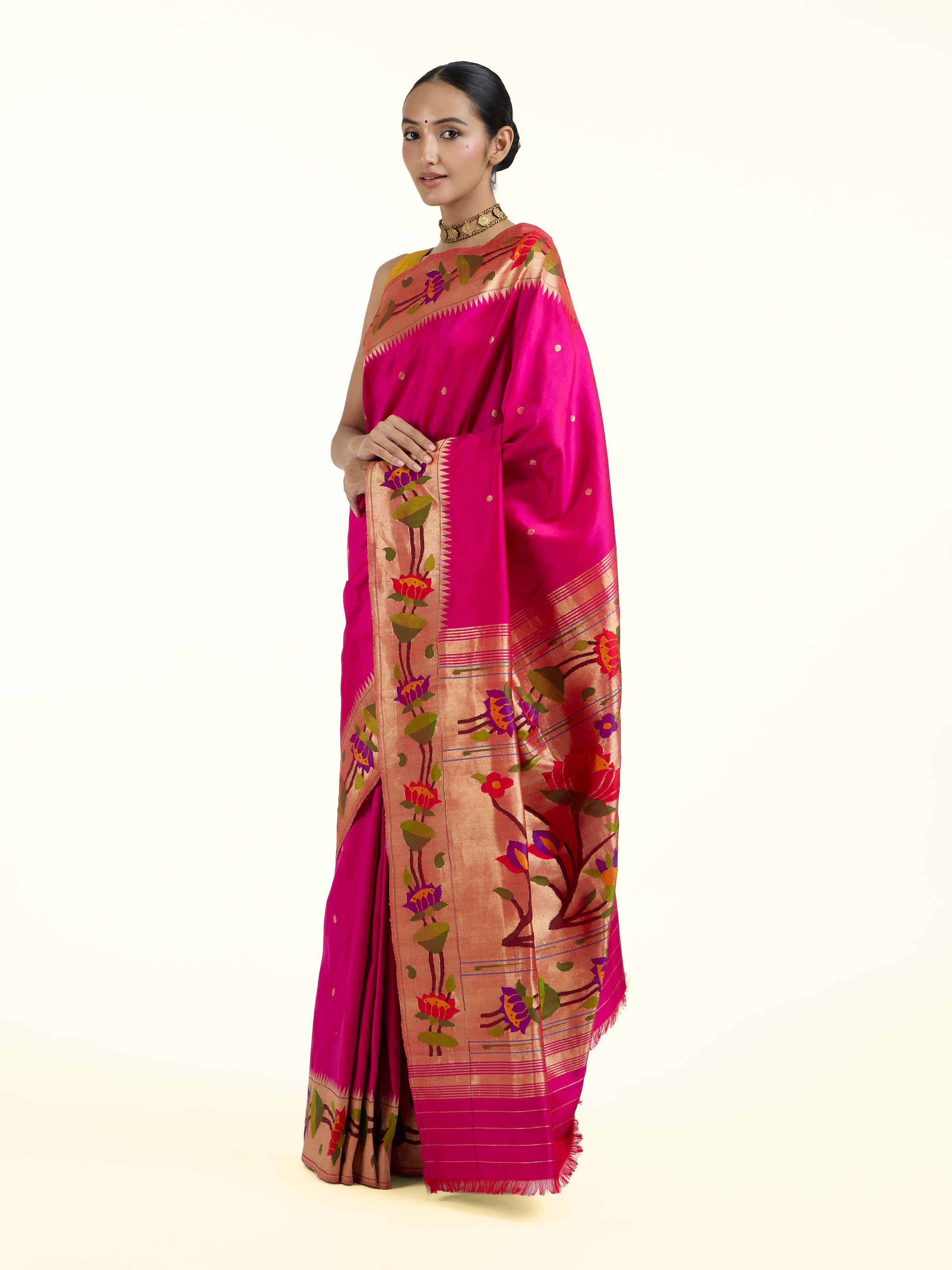 Side view of purple silk Paithani saree with elegant drape and ornate border