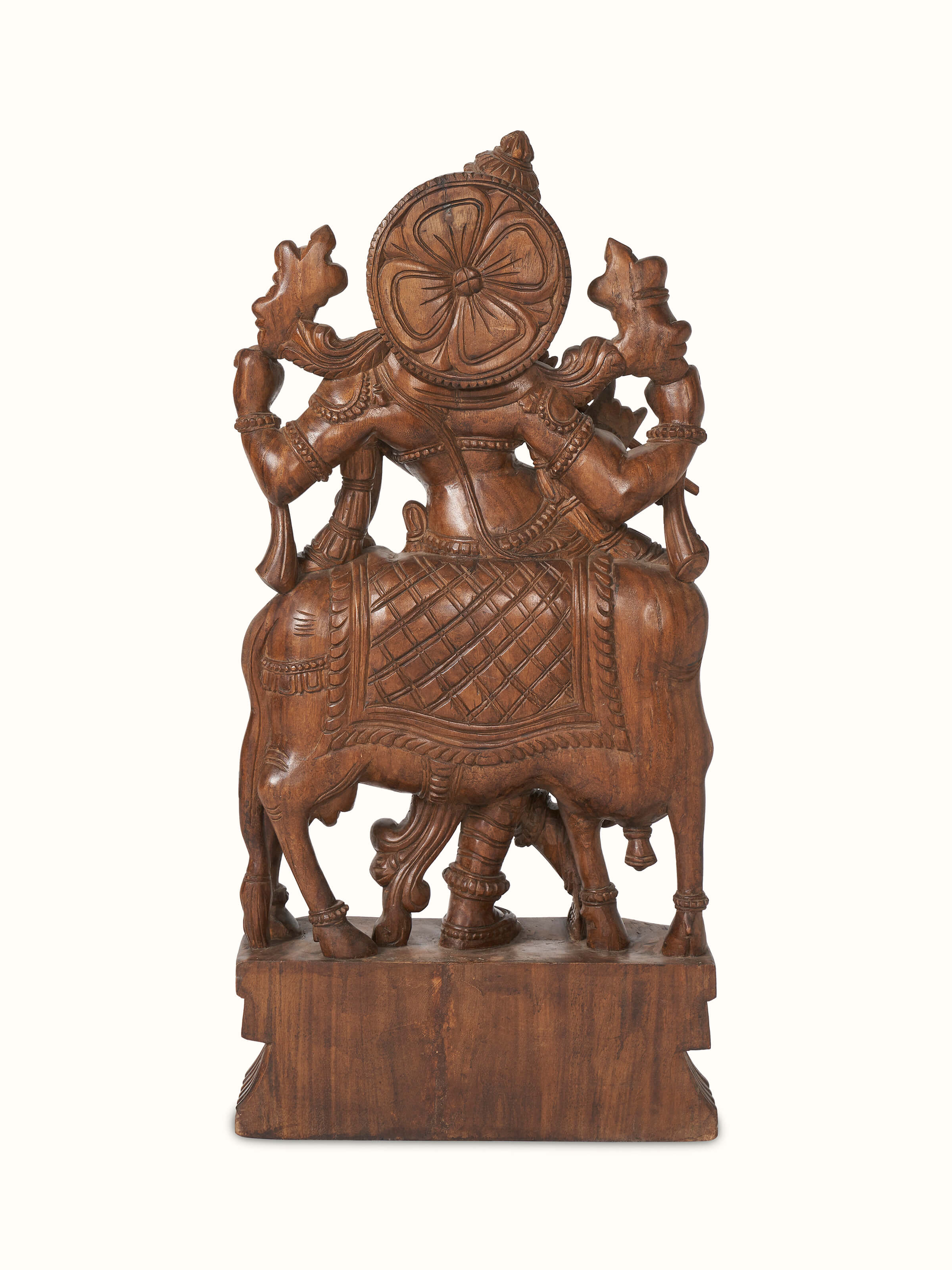 Close-up view of Ananta Mara Silai carved Vaagai wood Krishna with flute idol, showcasing fine details