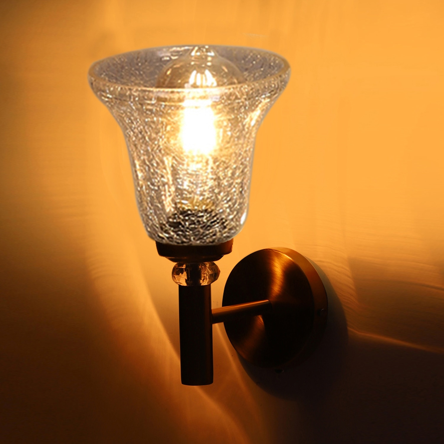 Devansh Metal Electric Wall Light in Gold Colour with Transparent Shade Count of 1 Light