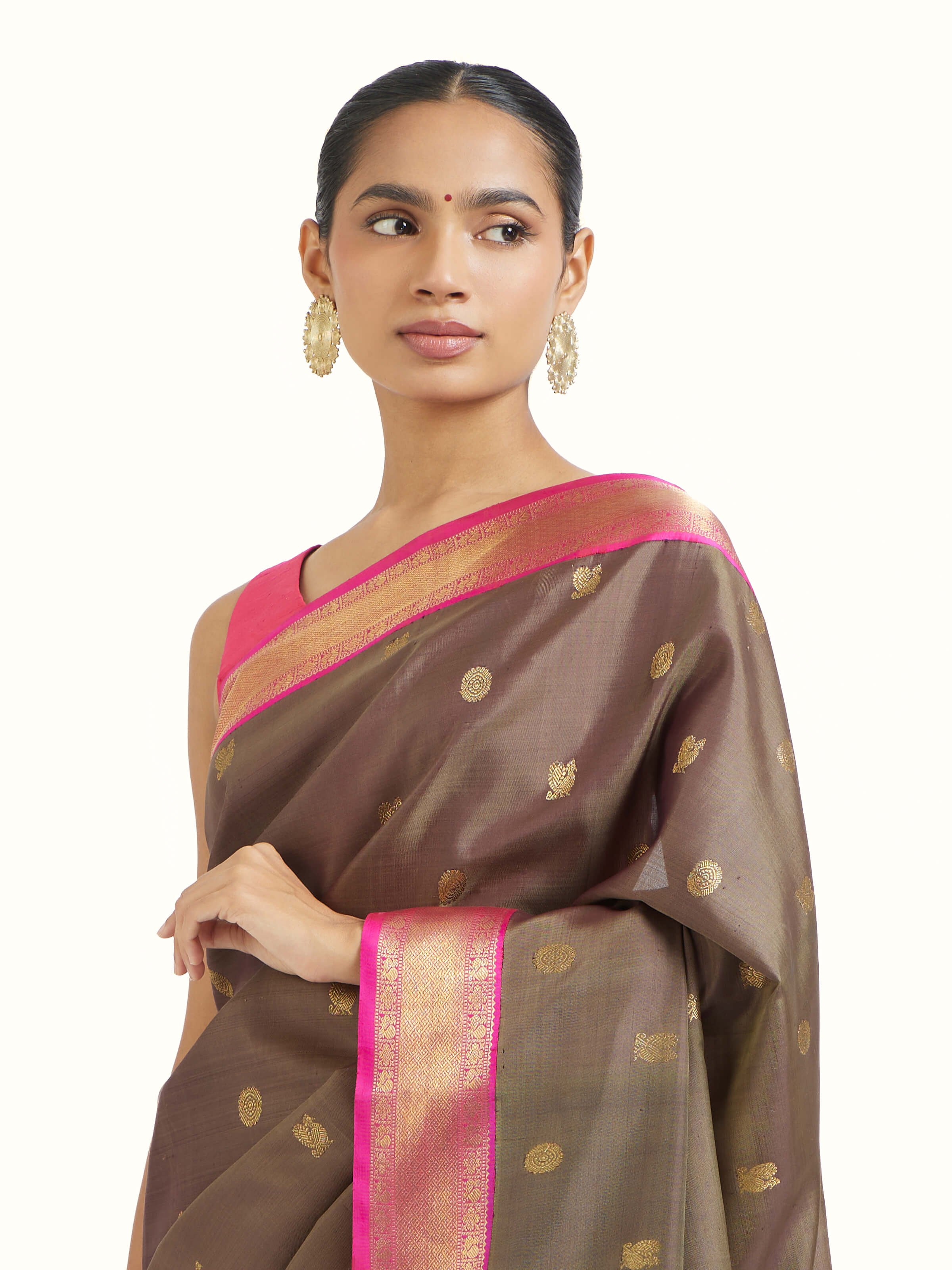 Angled view of dark grey silk Kancheepuram saree highlighting traditional silk weave