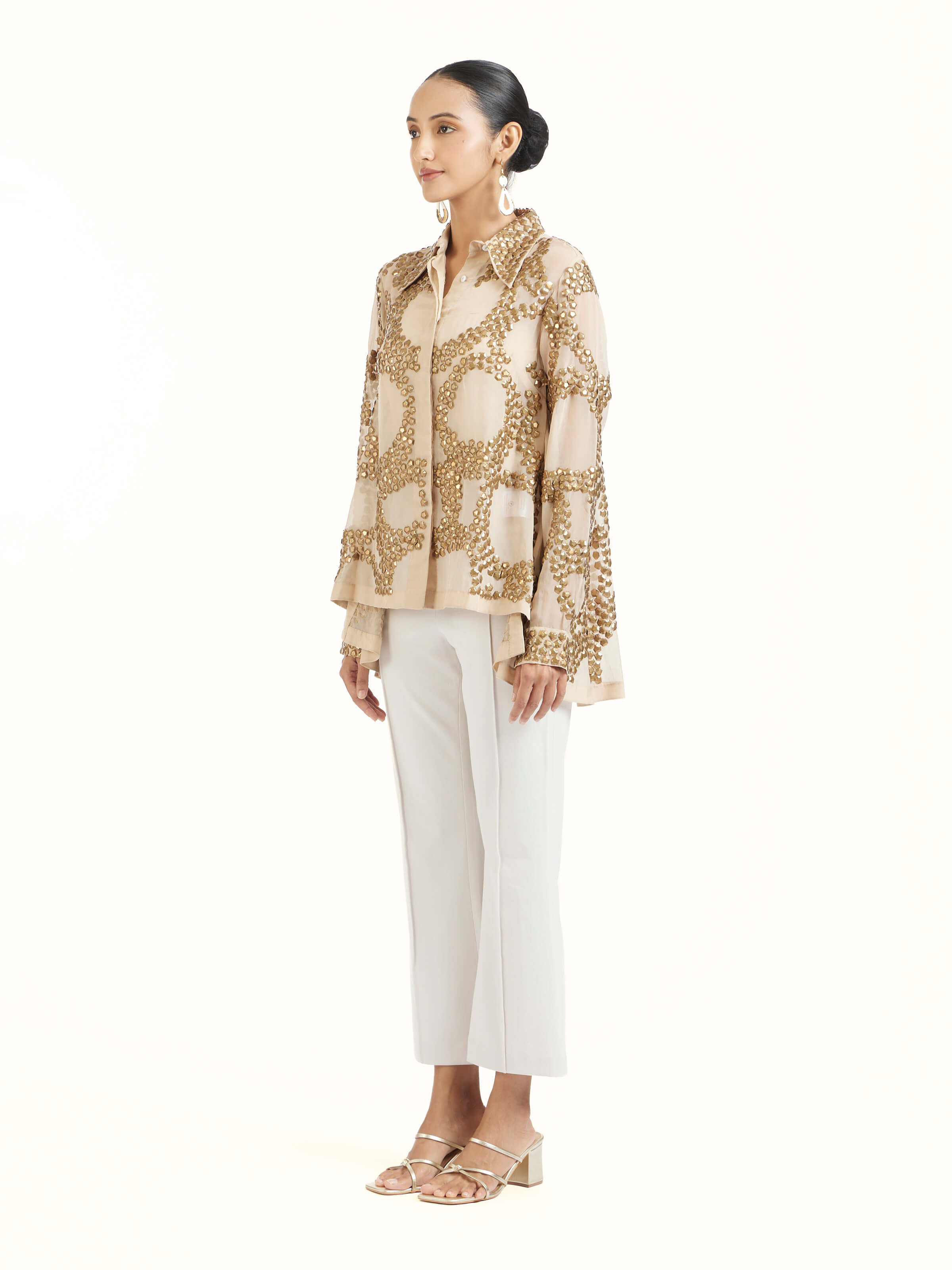 Side view of beige hand embroidered organza gold shirt showcasing tailored silhouette