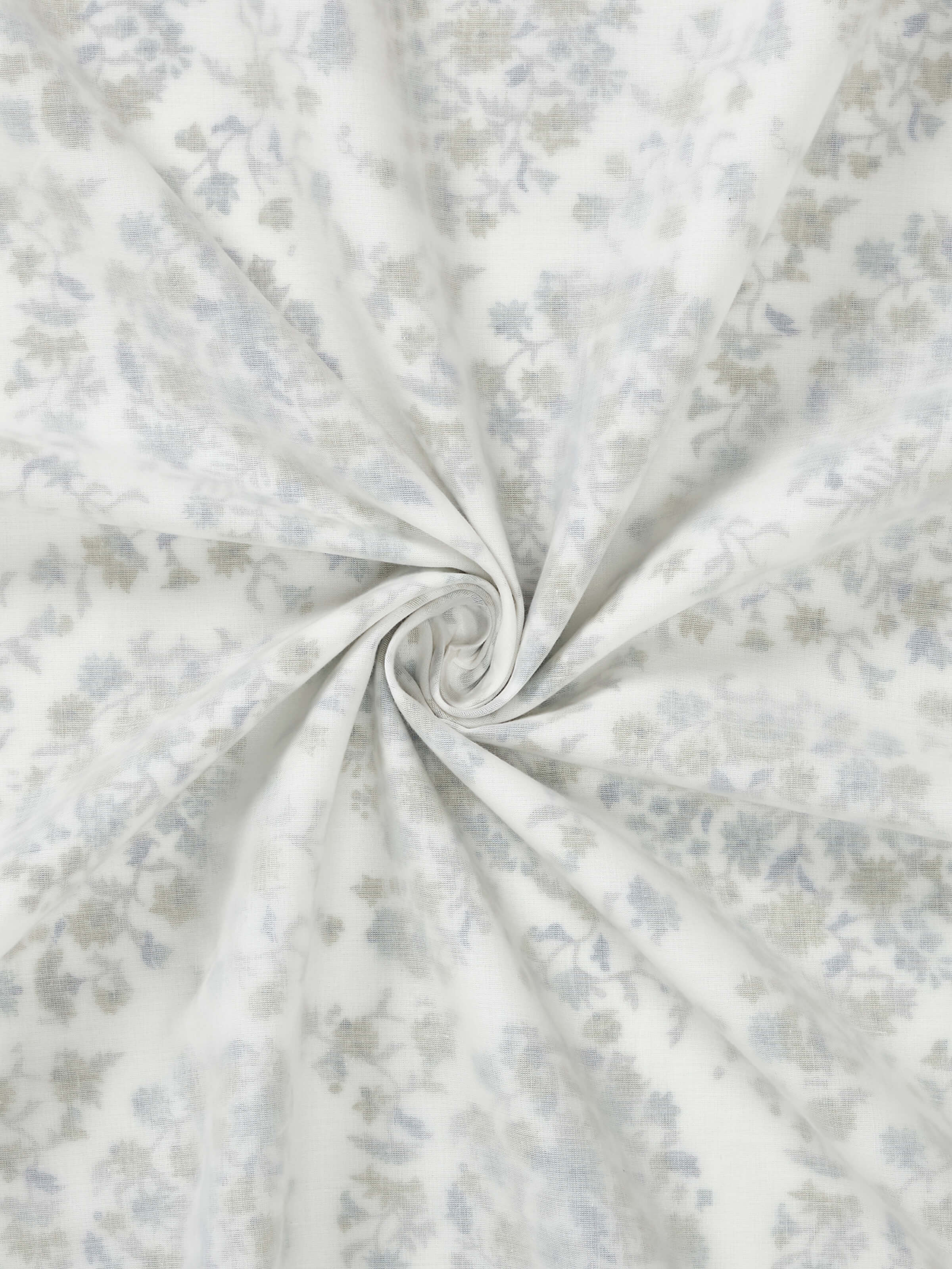 Close-up showing floral paisley pattern and cotton layering.