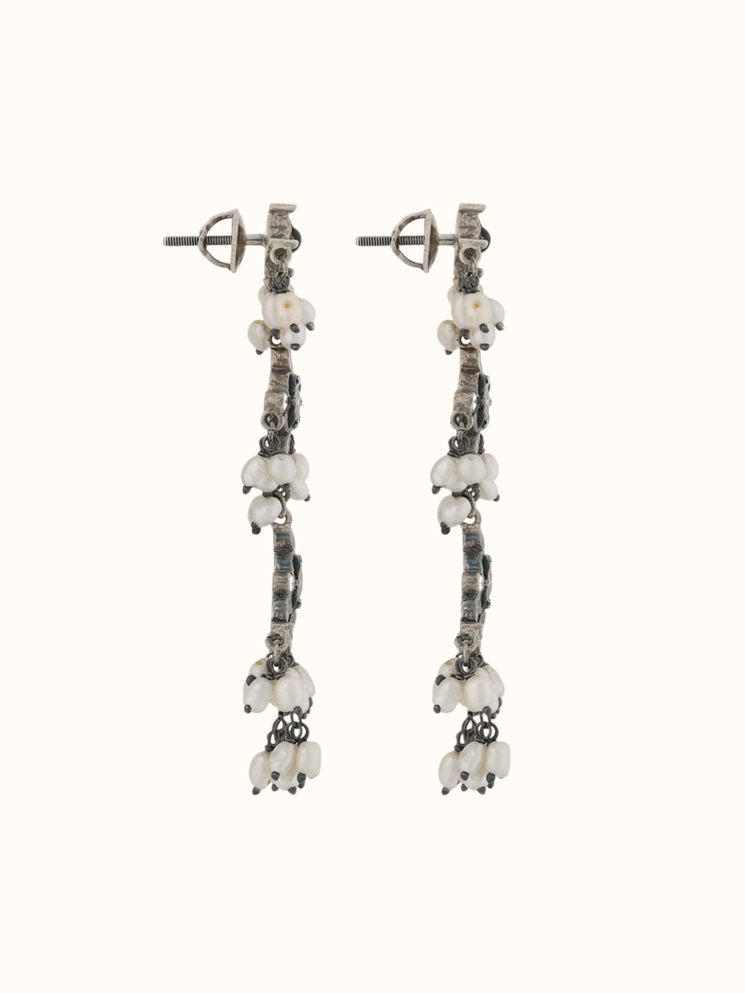 Side profile revealing the earring's elegant drop and cluster beadwork