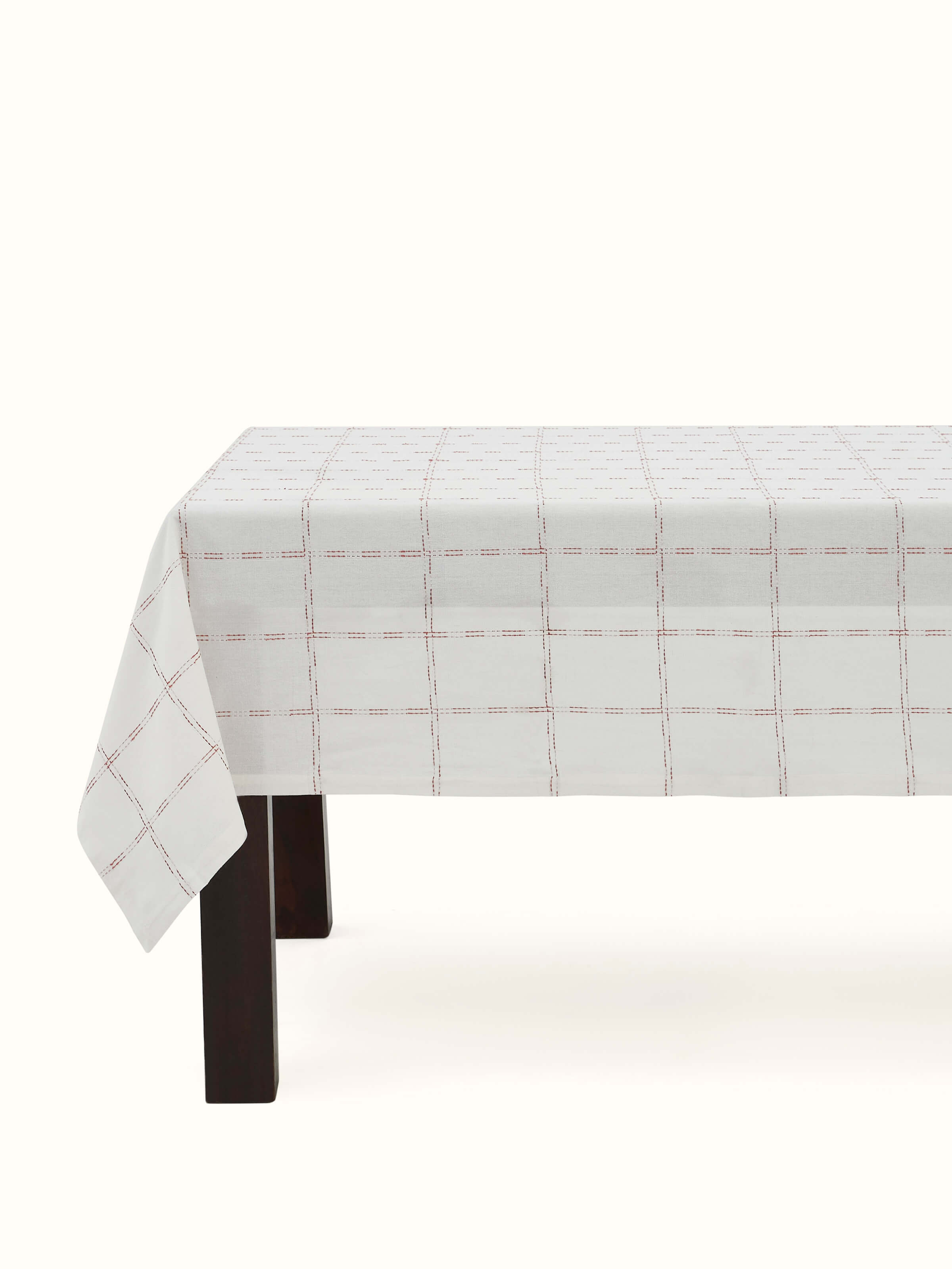 Front view showcasing the full rust checkered cotton handloom table cover, perfect for 6-seater tables