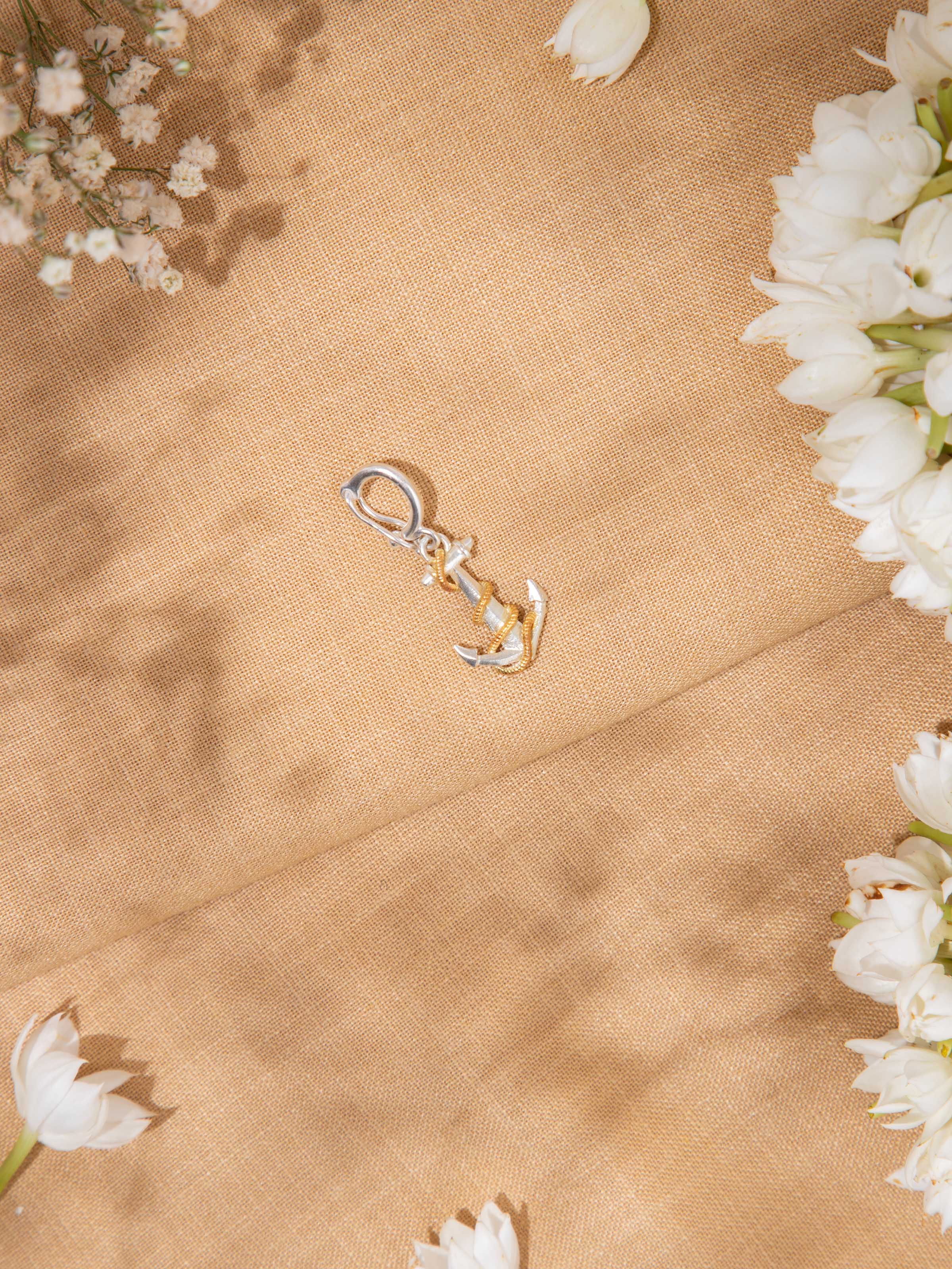 Silver smithing pendant displayed on chain – Swadesh