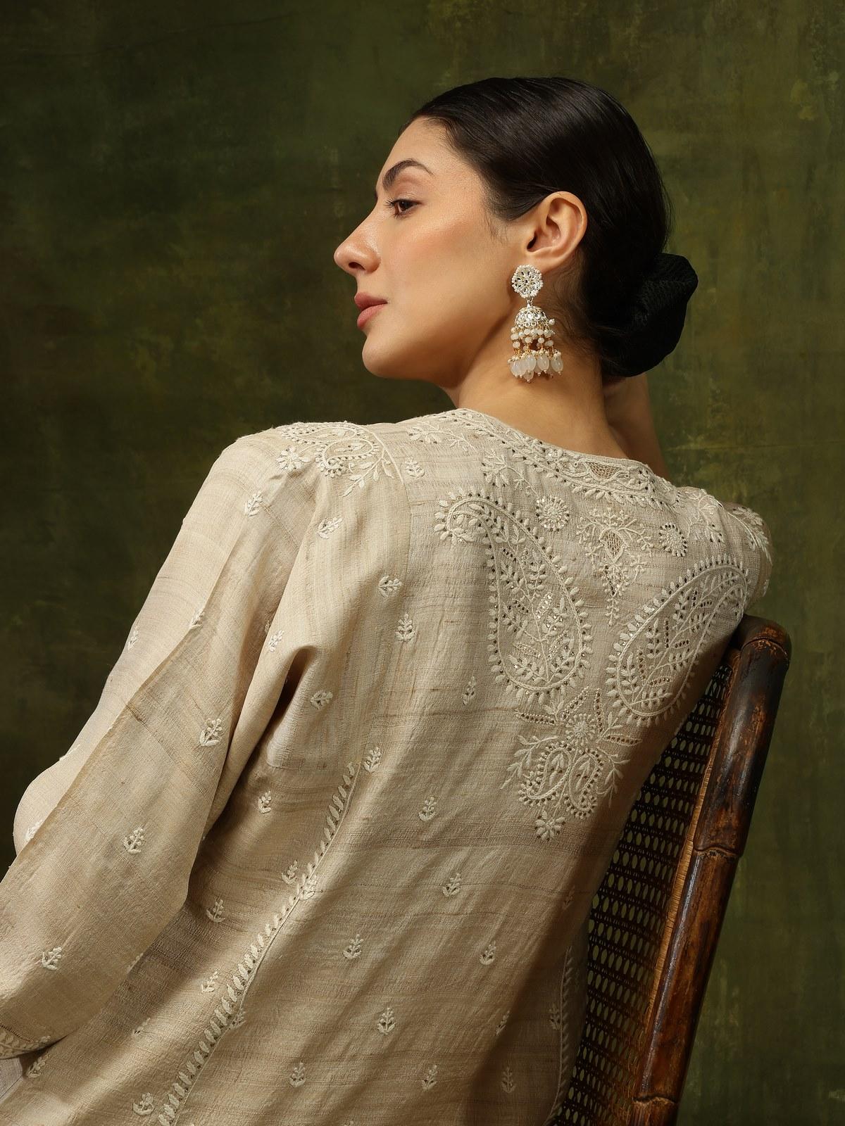 Detail view focusing on the intricate Chikankari motifs that elevate this jacket to a timeless classic.