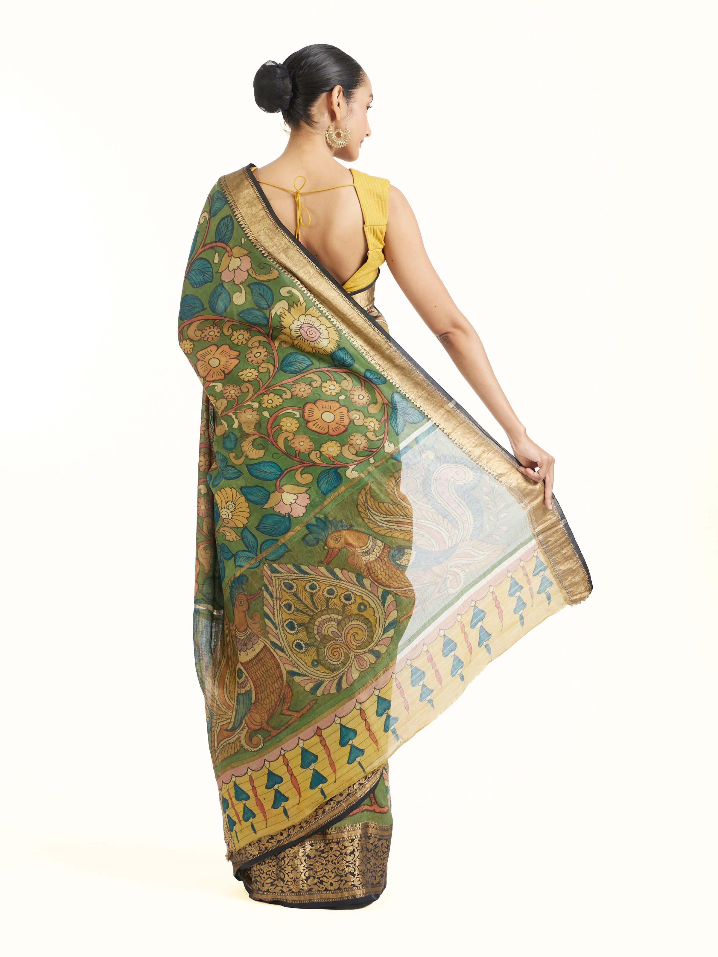 Detail view of kalamkari chiniya silk saree showing fabric texture and painted details