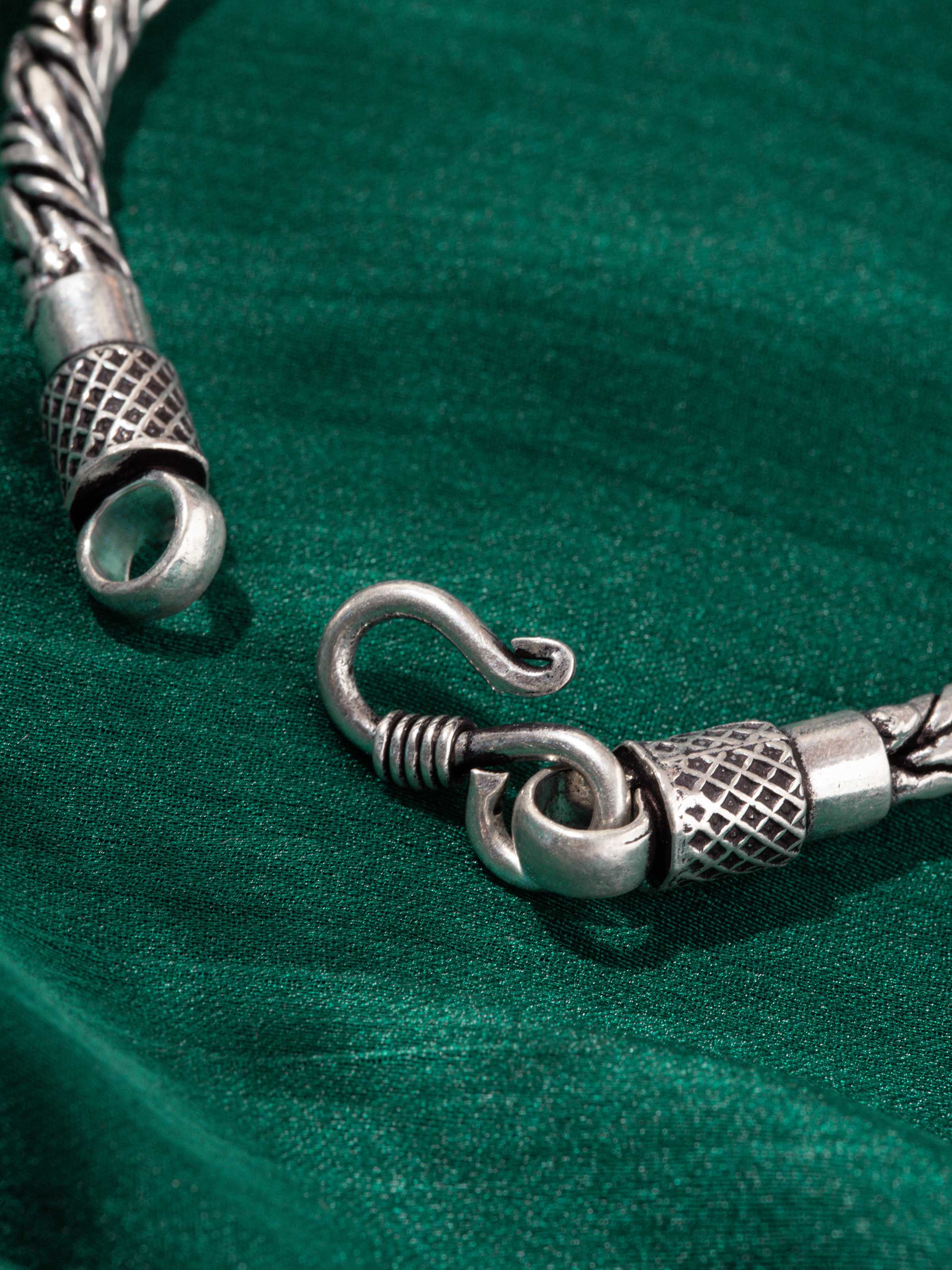 Close-up detail of bracelet links and clasp showcasing oxidized silver finish and sturdy build.