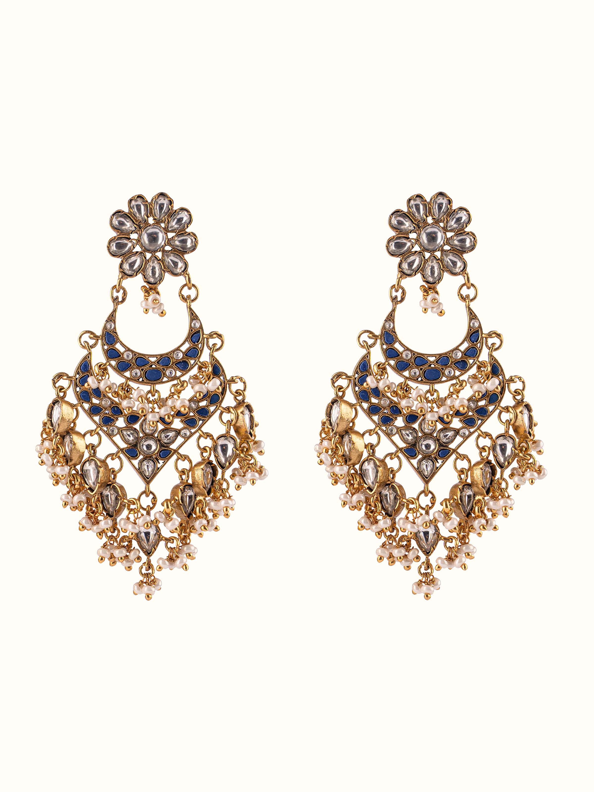 Front view presenting the classic silver smithing work on the Chandbalis