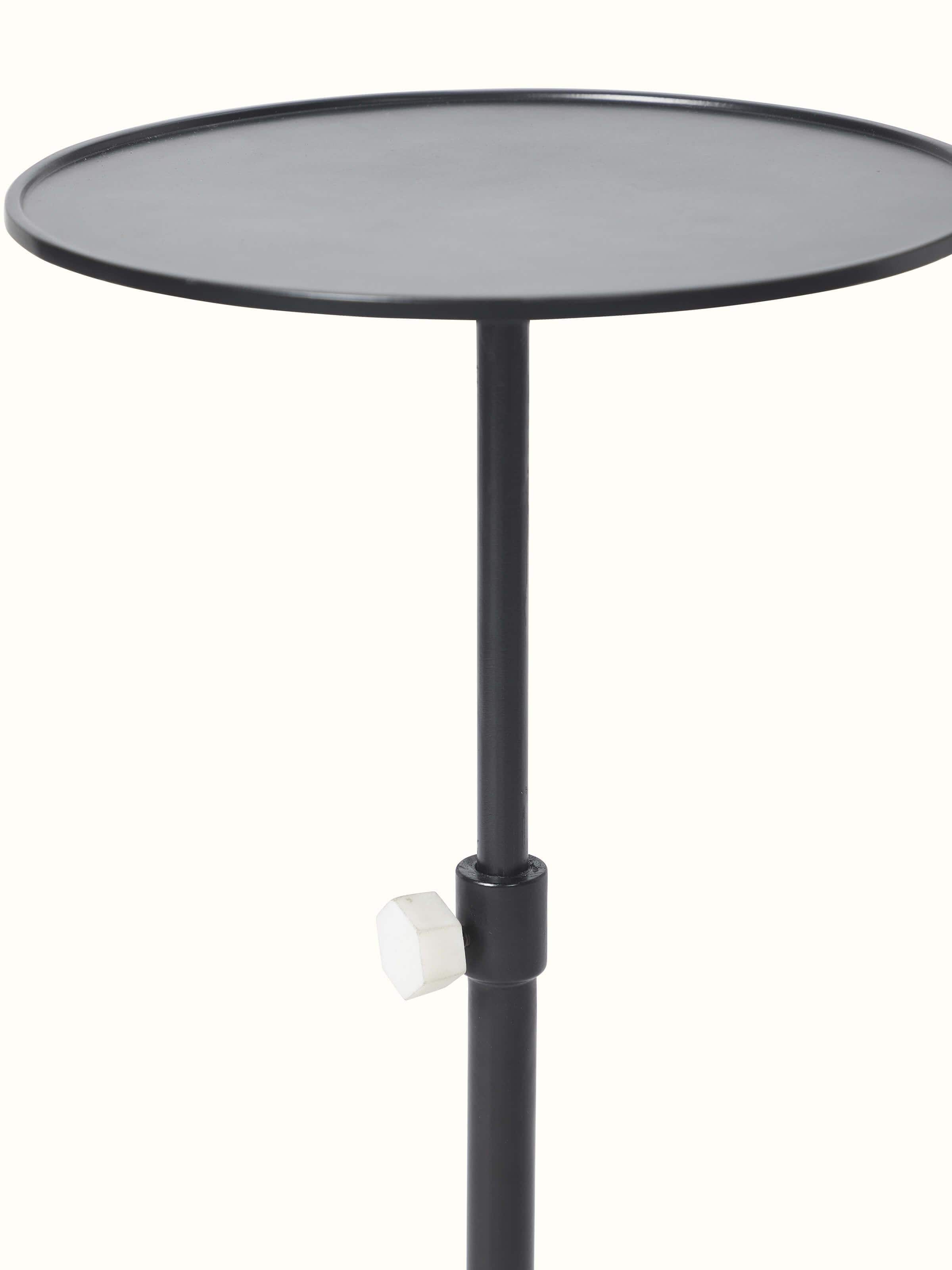 Angled view of carved marble & metal end & side table showing detailed carving work