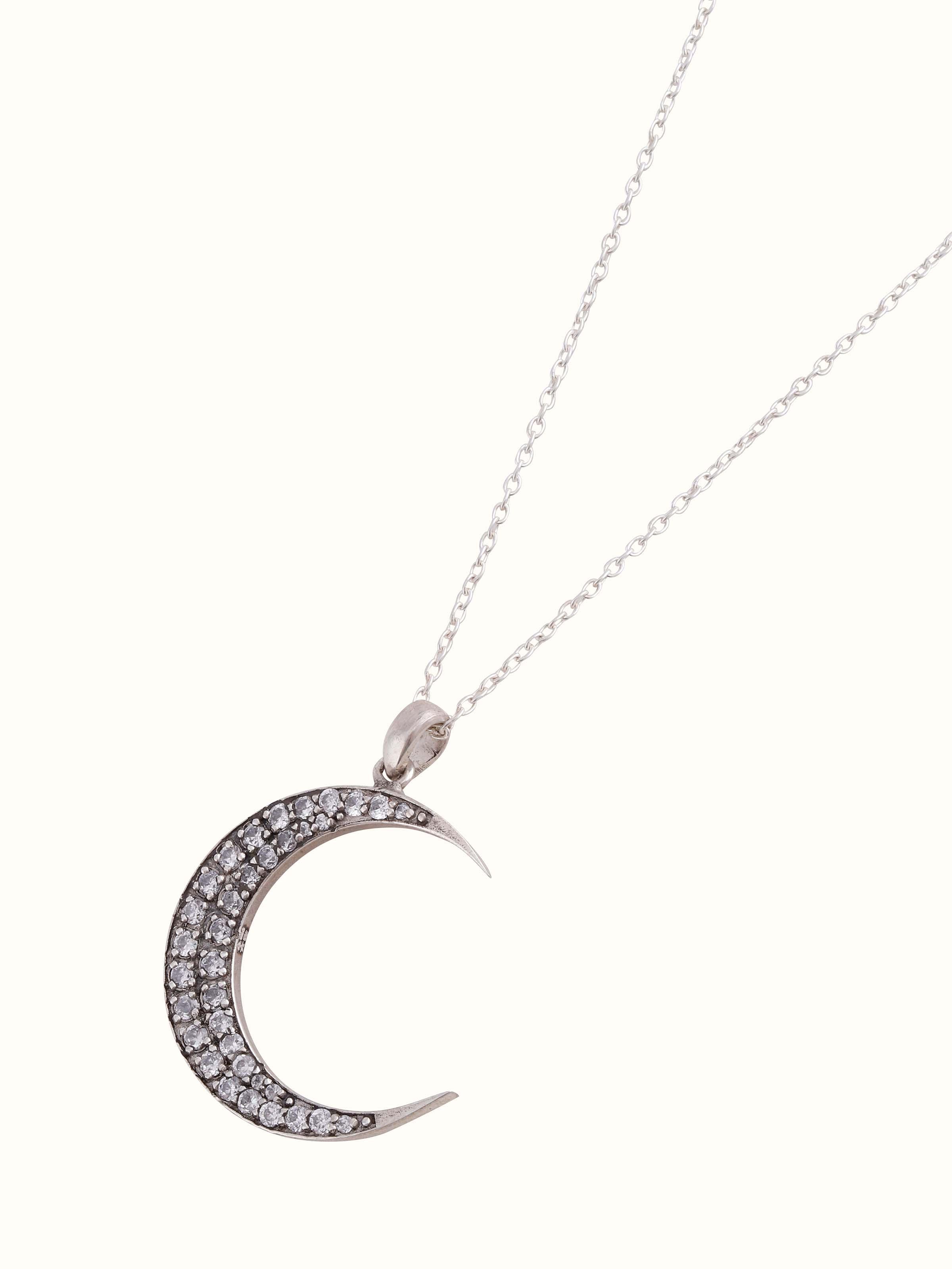 Artistic overhead angle showing the overall design of the pendant and chain