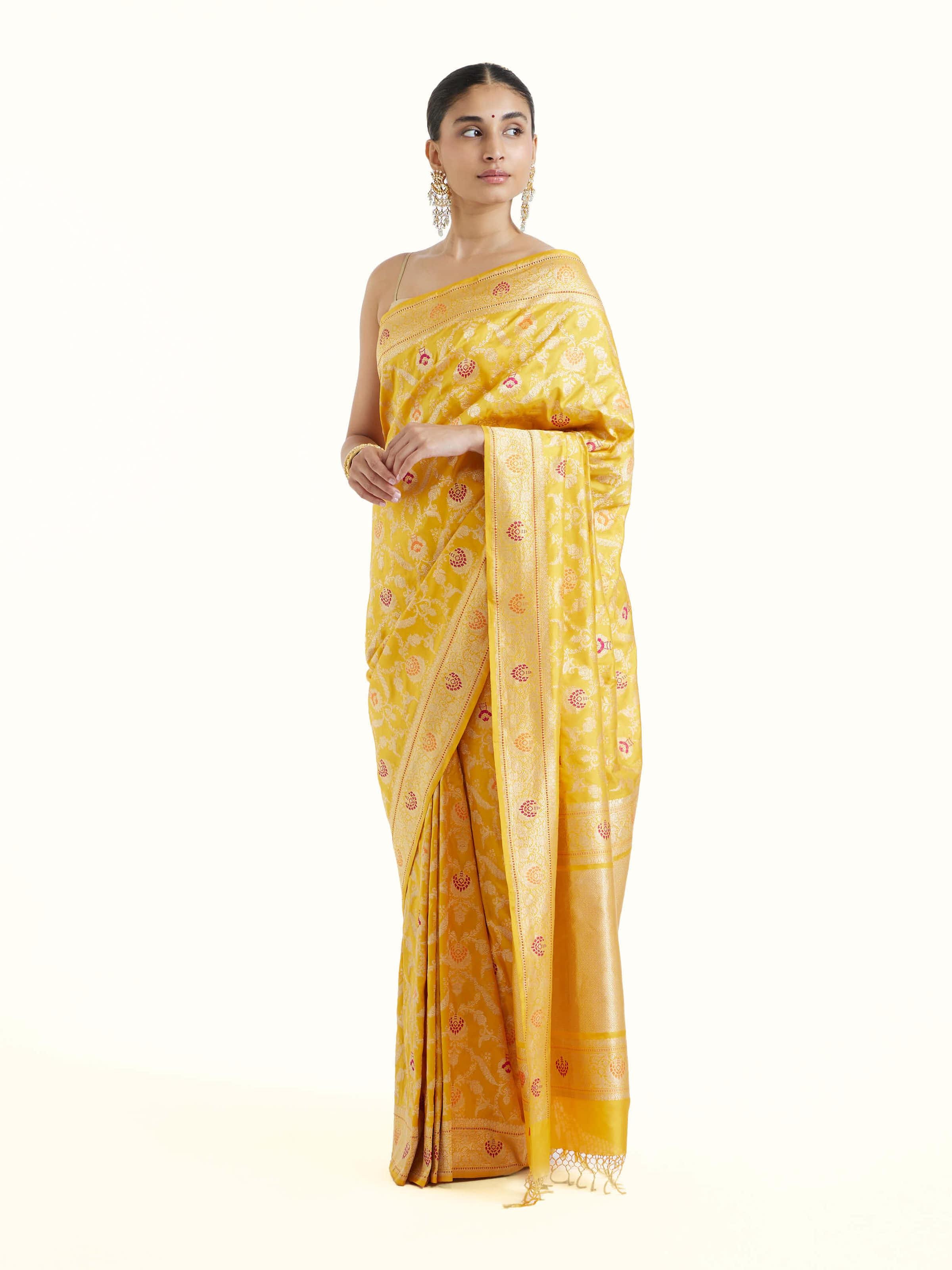 Side view of yellow Banarasi silk kadwa jaal saree with elegant drape and ornate border