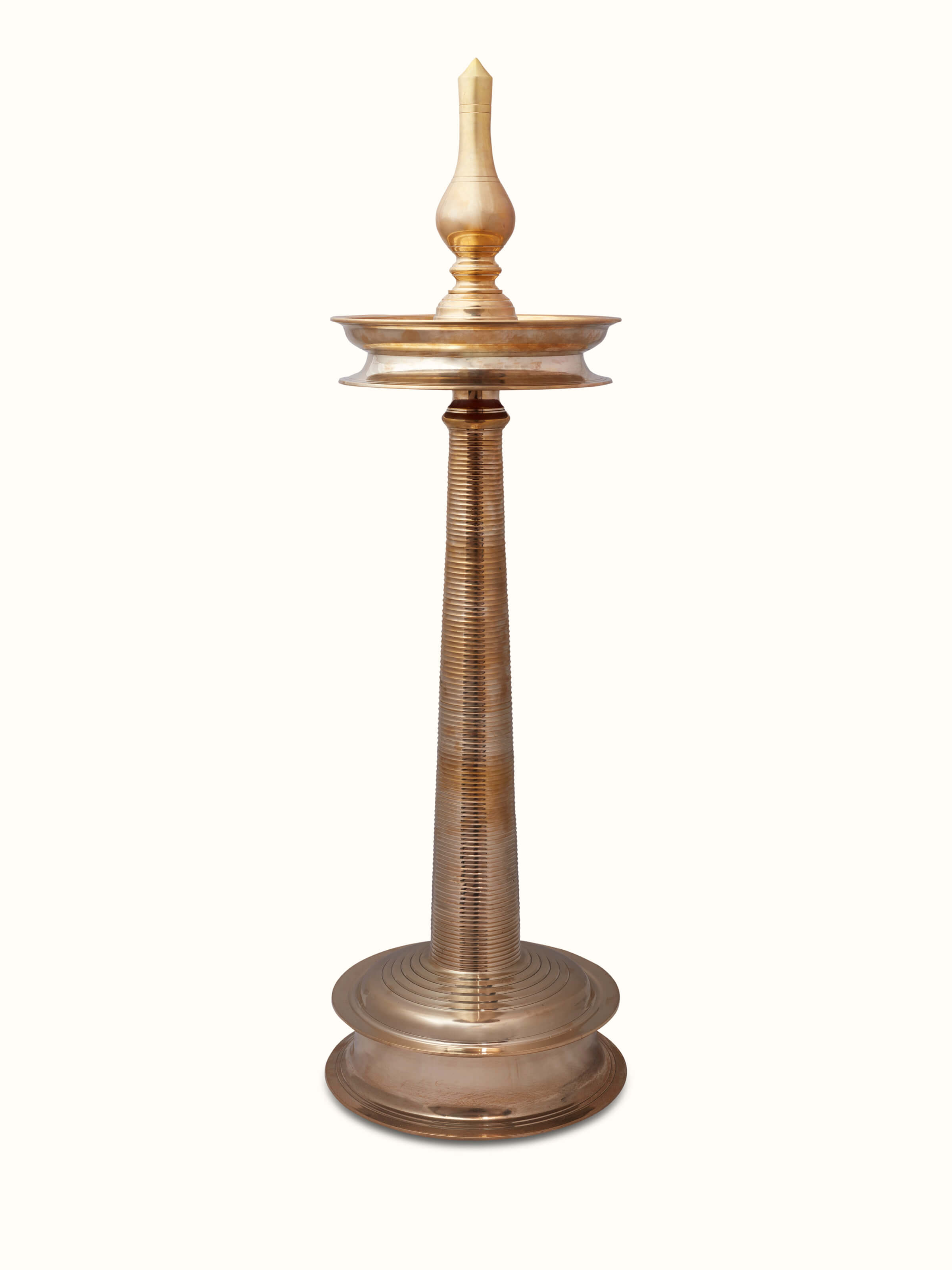 Front view of Vilakku brass stand diya highlighting the traditional design and shine