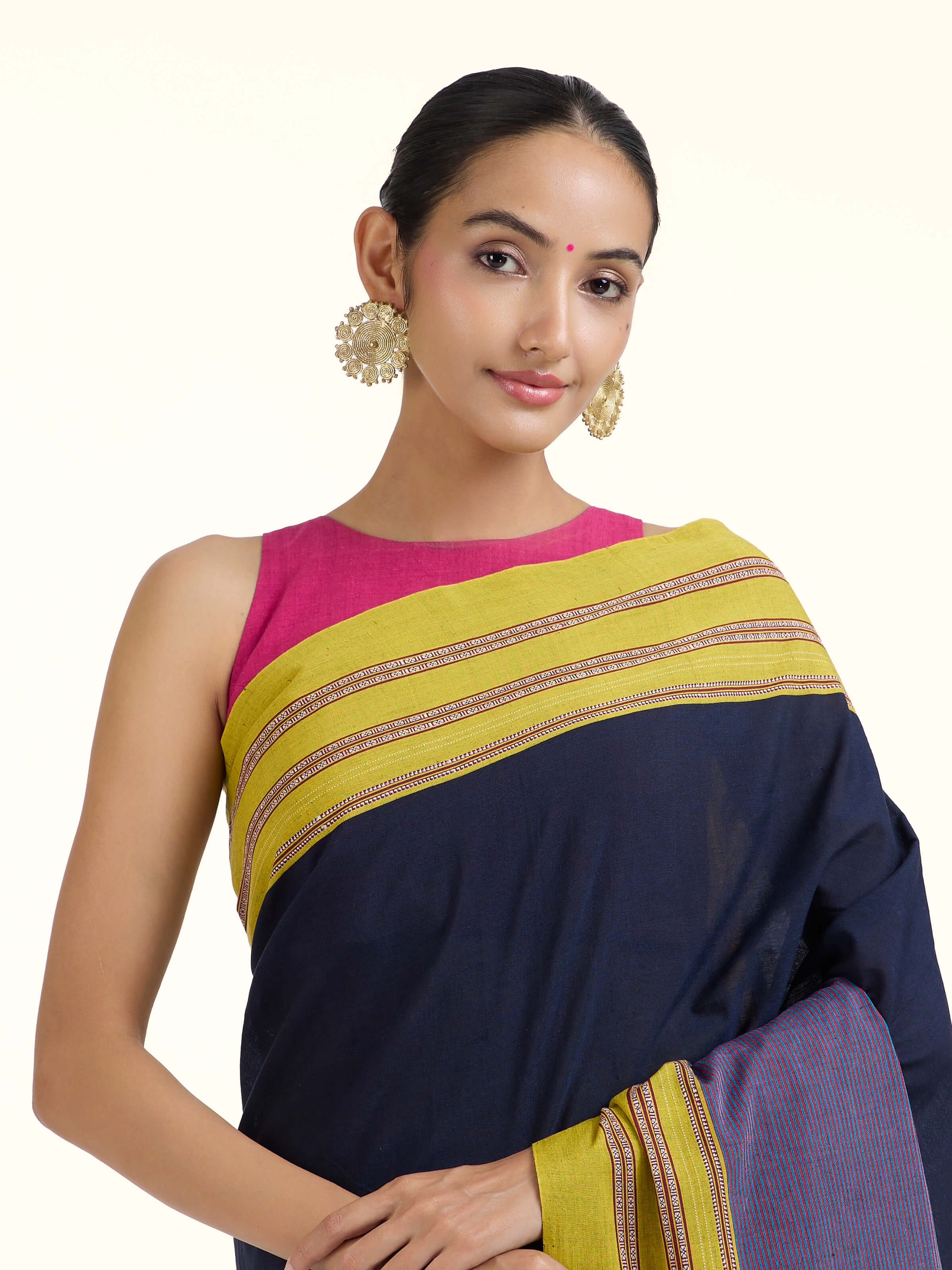 Angled view of navy blue cotton and silk Ilkal saree emphasizing Ilkal weave and texture