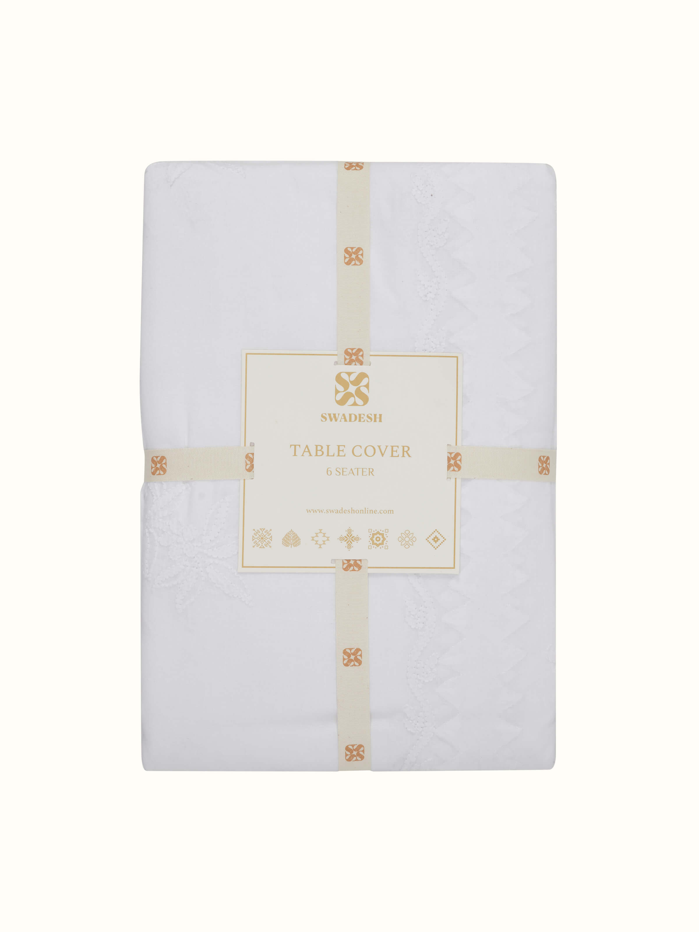 Close-up showing the fine texture and floral threadwork in soft focus