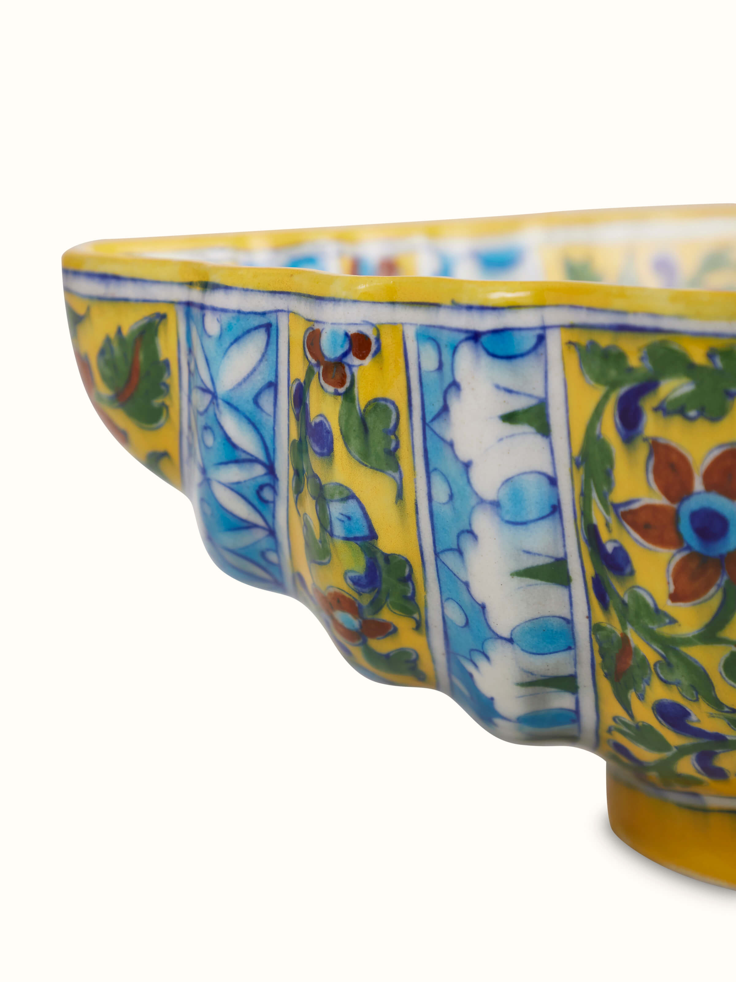 Angle view of Blue pottery ceramic blossom shell artpiece multicolor