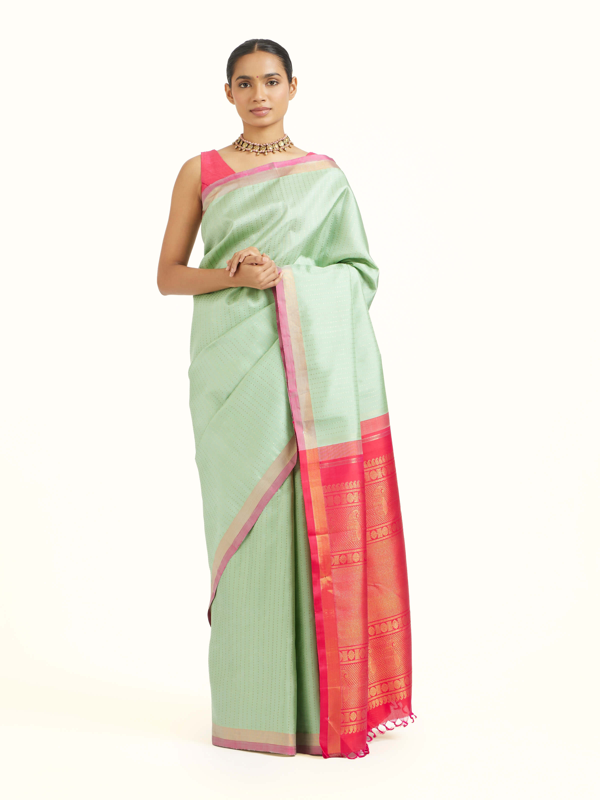 Front view of light green silk Kancheepuram saree with rich zari motifs