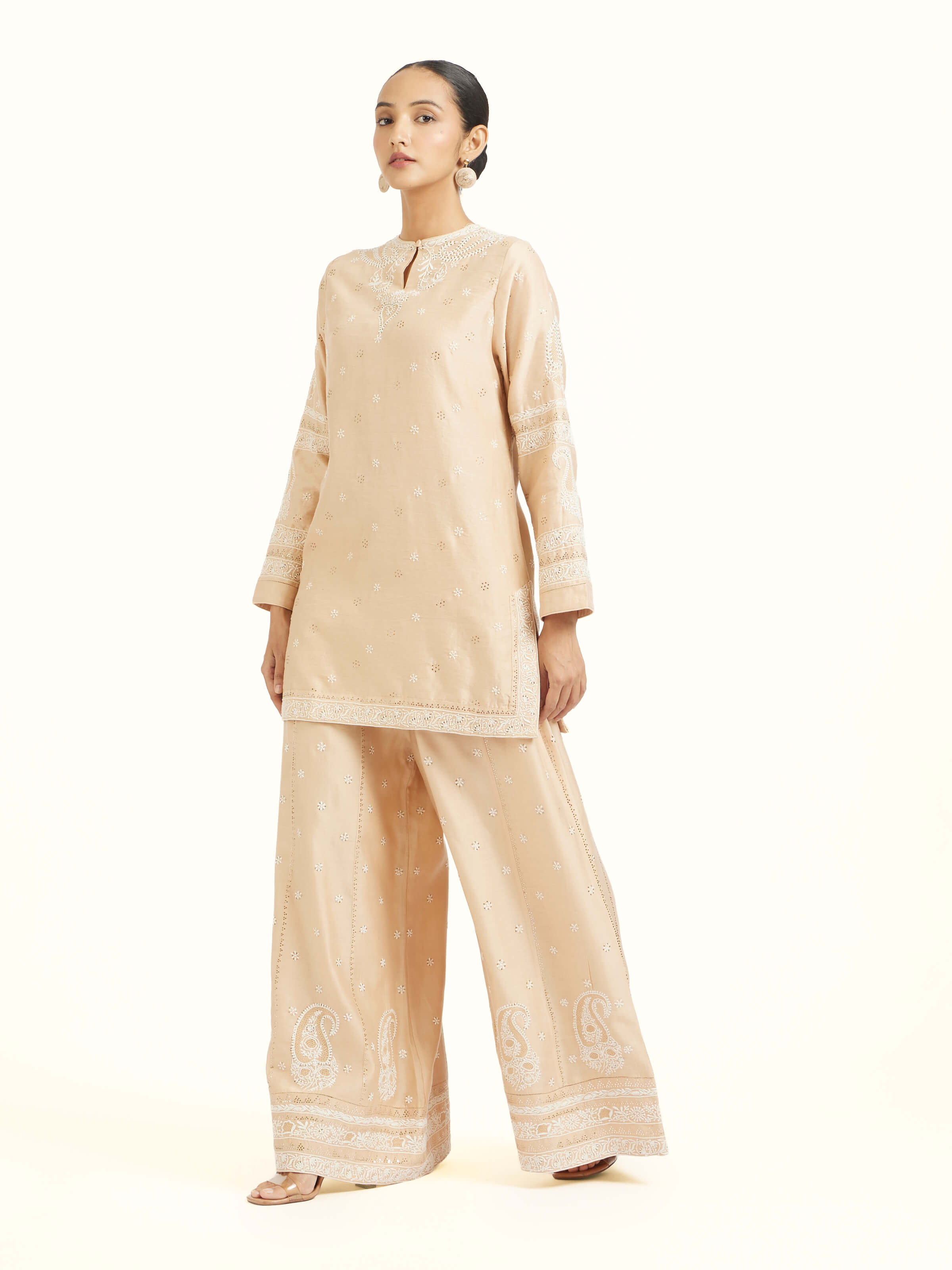 Side view of beige silk Chanderi kalidar sharara showcasing silhouette