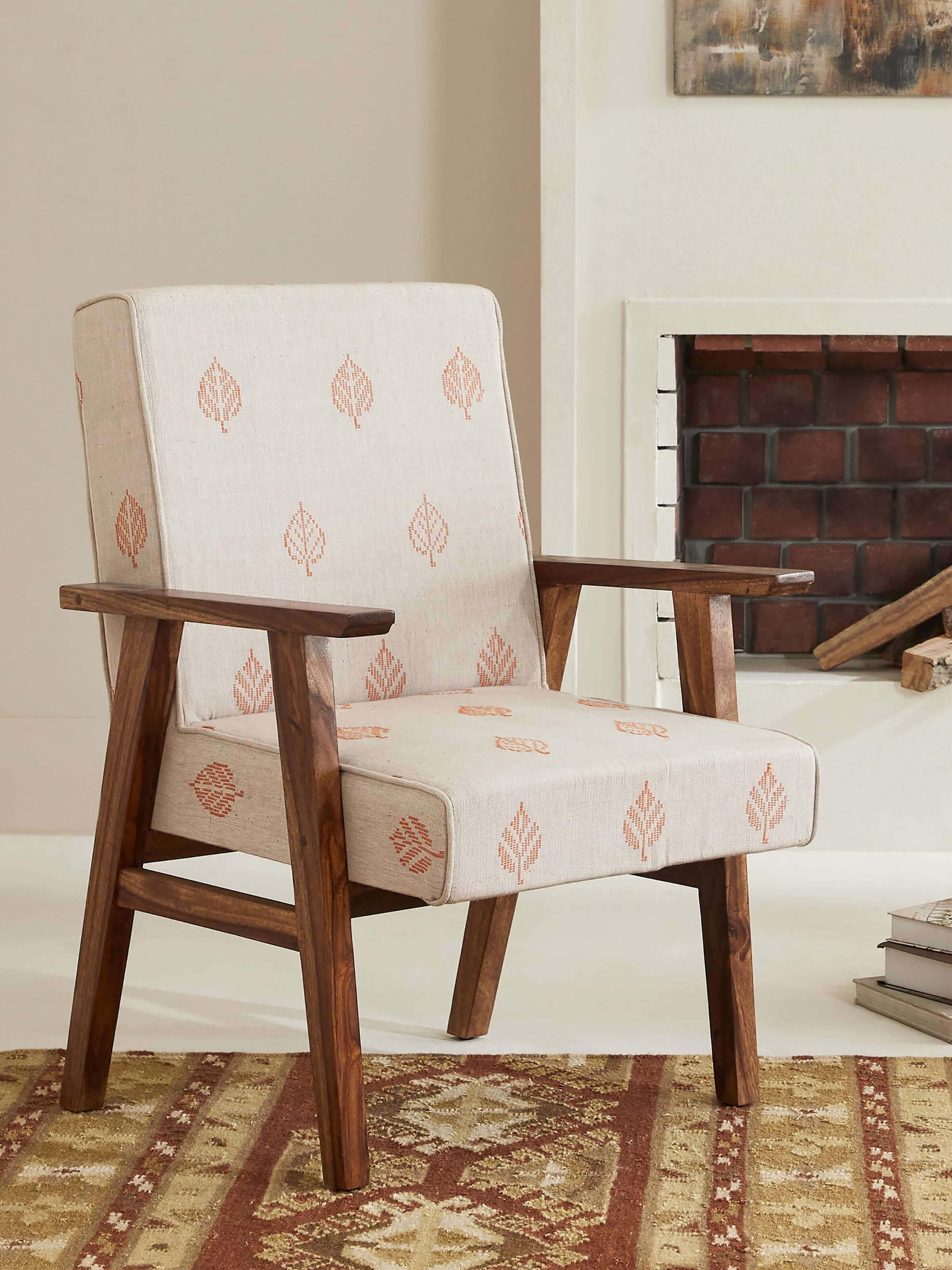 Side view of Bawan Buti Upholstered Sheesham Wood Study Chair showcasing intricate carvings and plush upholstery.