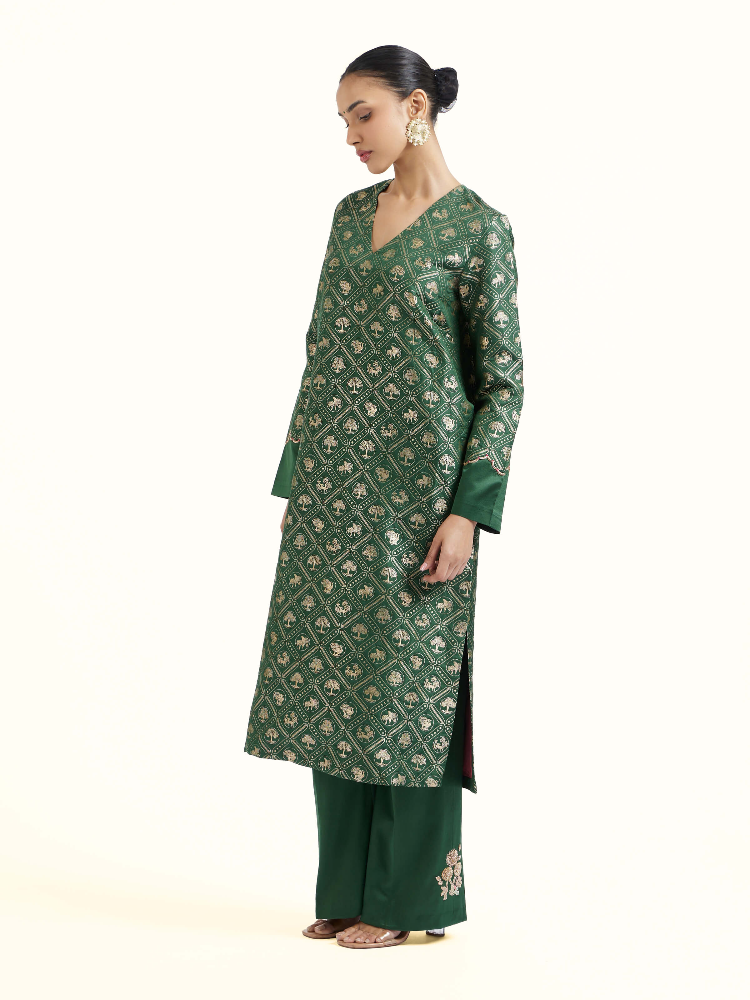 Side view of emerald green Banarasi kurta set showcasing coordinated silhouette