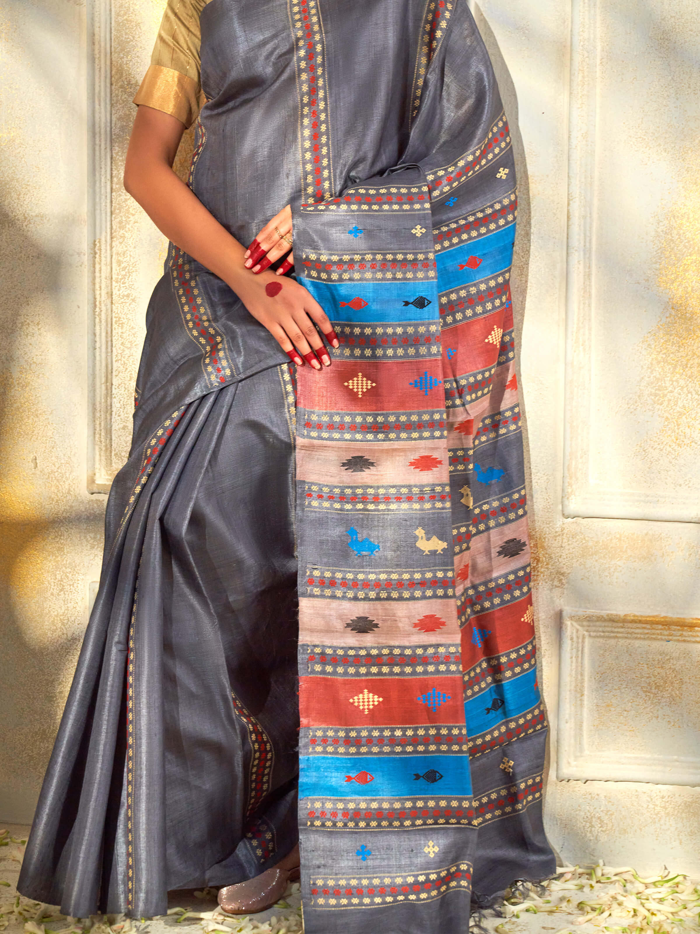 Detail view of black tussar silk extra-weft saree showing fabric texture and extra-weft craftsmanship