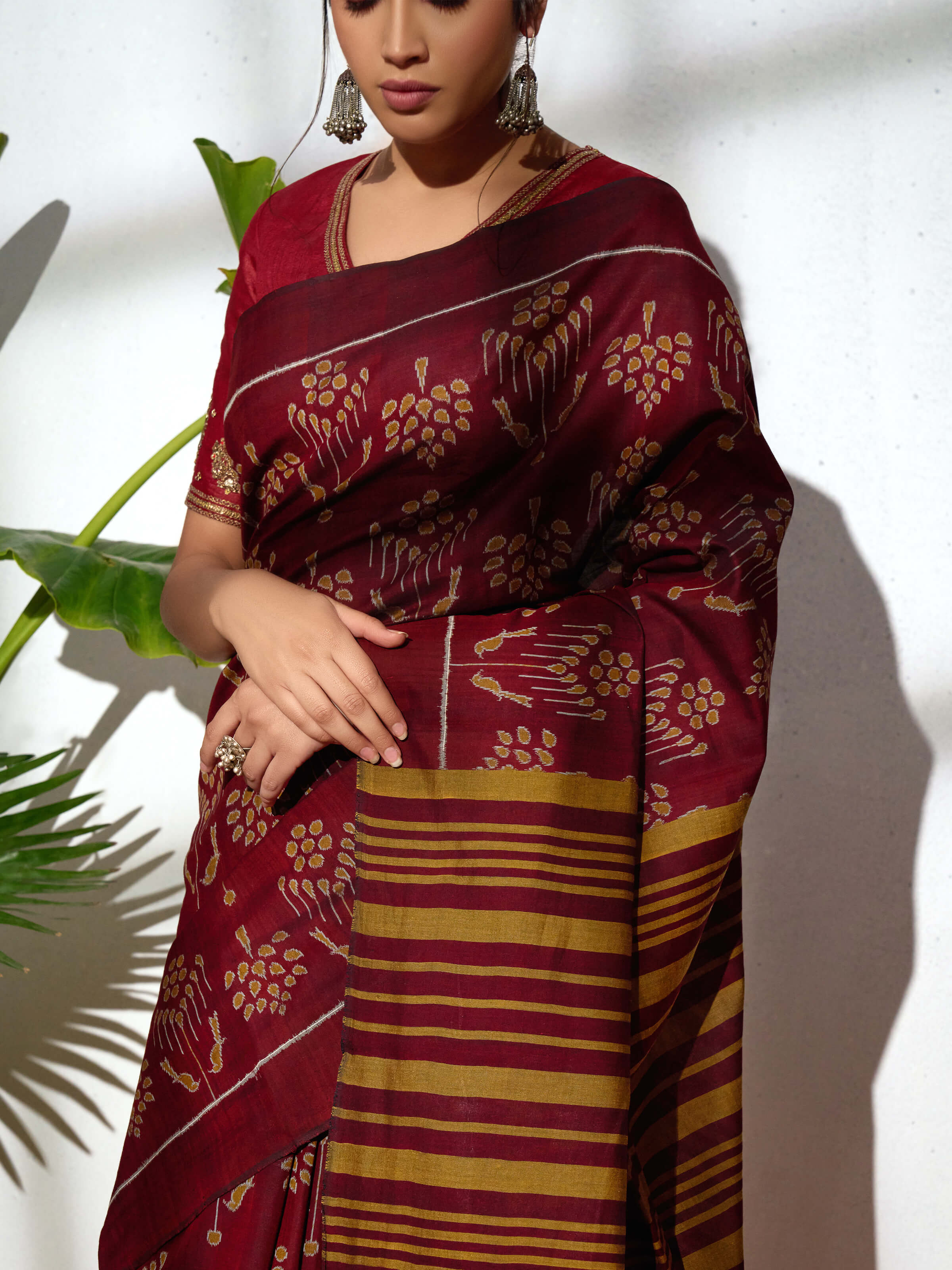 Detail view of brown cotton Odisha ikat bandha saree showing cotton texture and craftsmanship